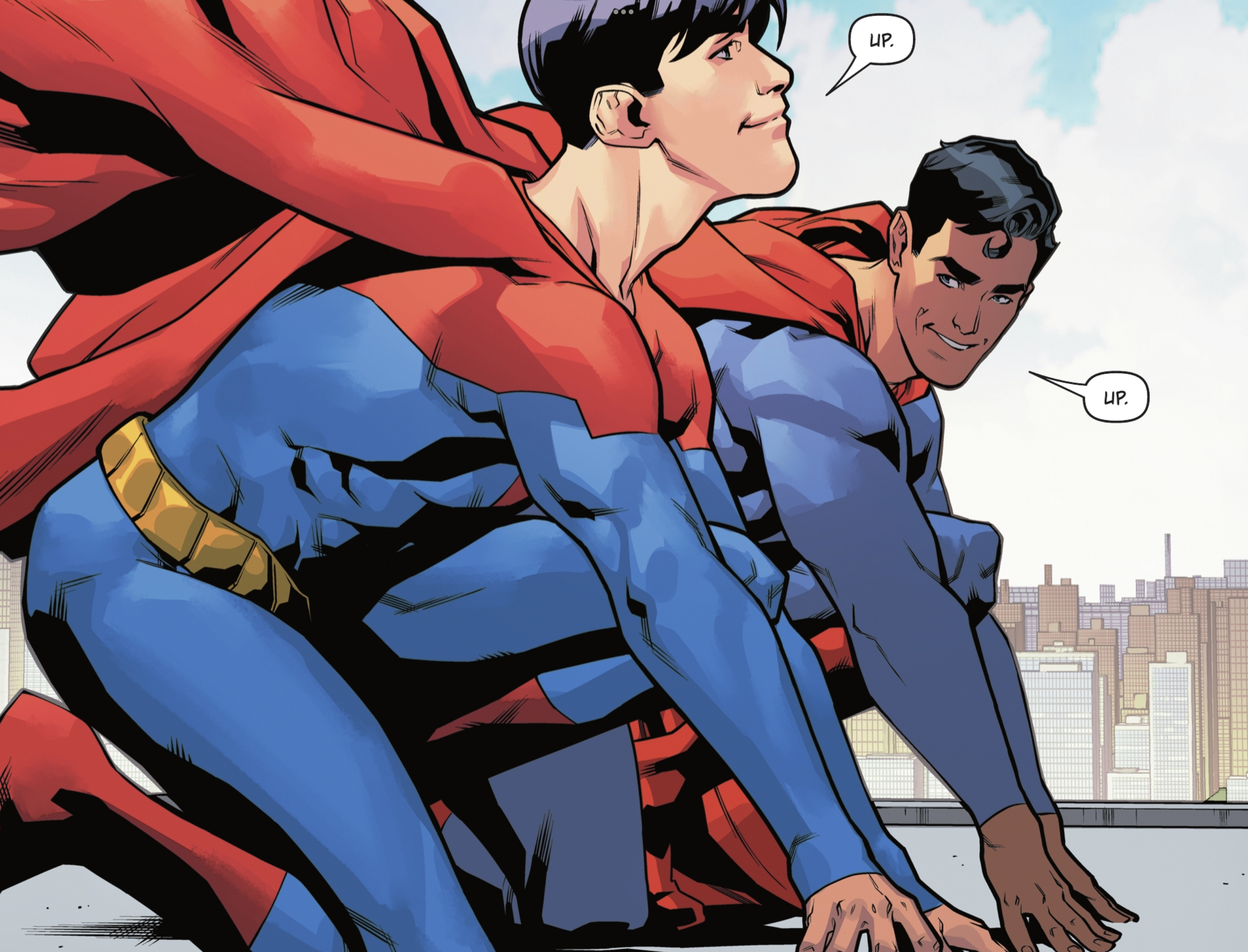 Crouching, Jon Kent/Superman and Clark Kent/Superman grin at each other. “Up.” “Up.” they take turns counting off the start of their race in Superman: Son of Kal-El #17 (2022). 