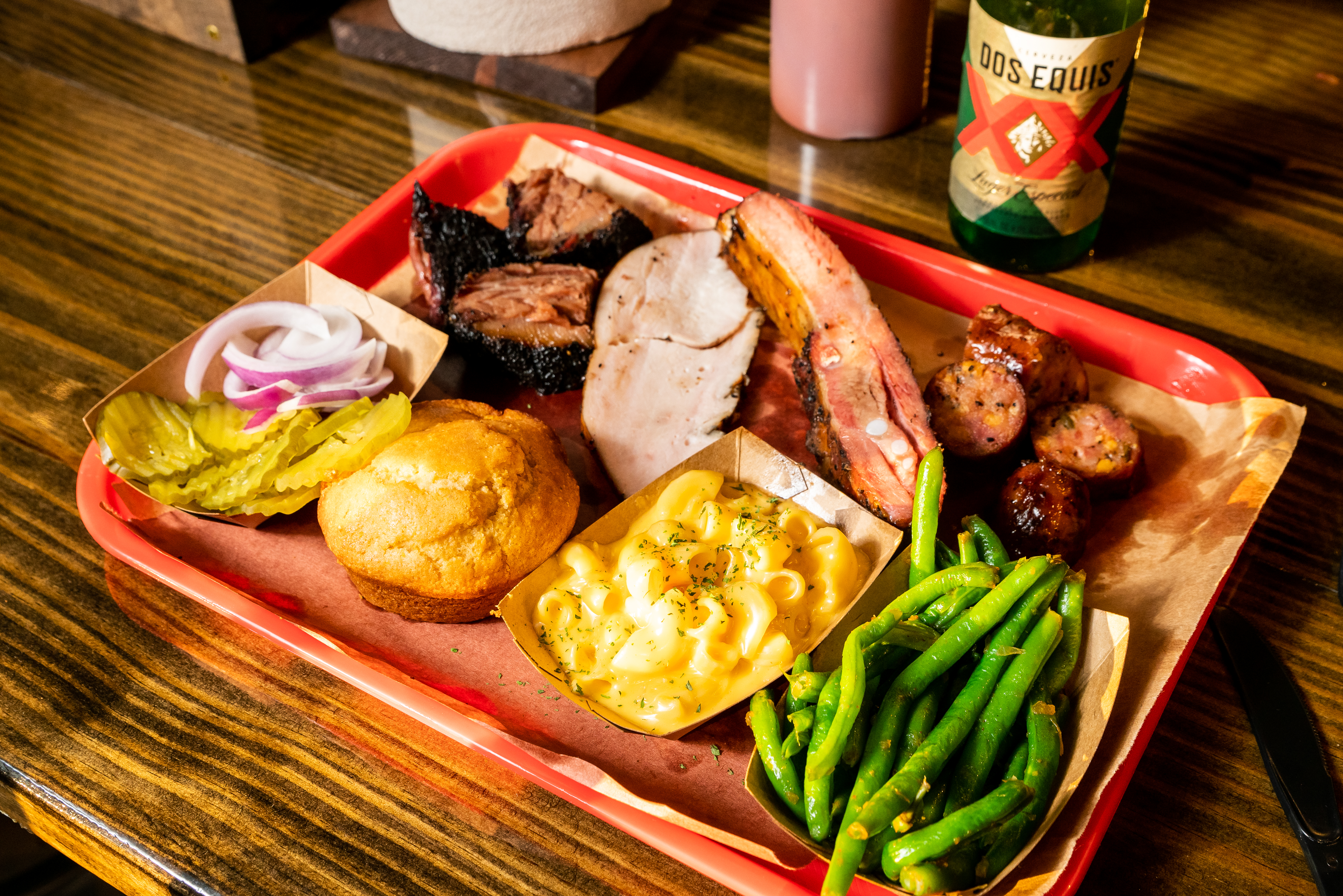 A tray of barbecue meats and sides.