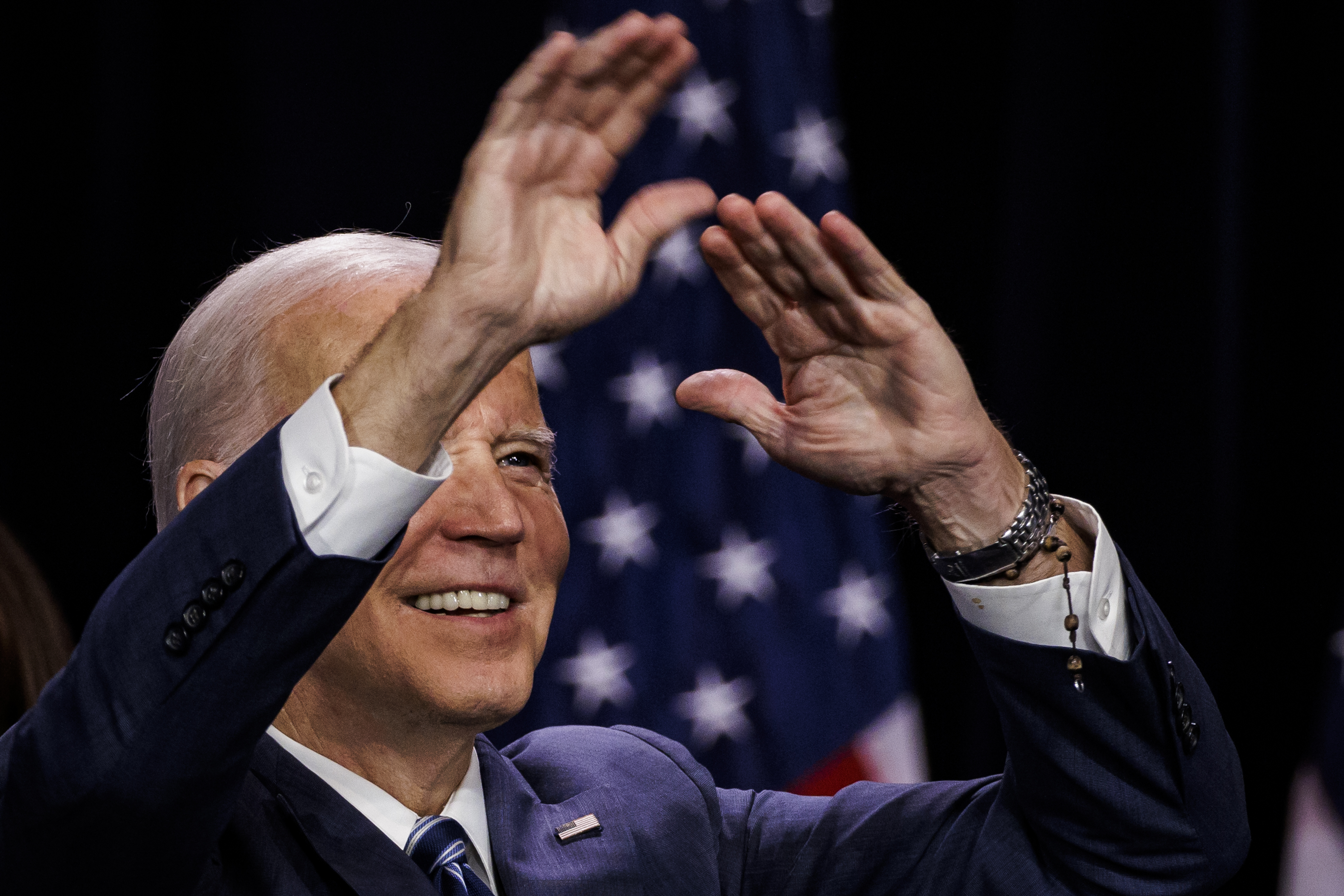 President Joe Biden waves after speaking at an event hosted by the Democratic National Committee at the Howard Theatre in Washington, DC.