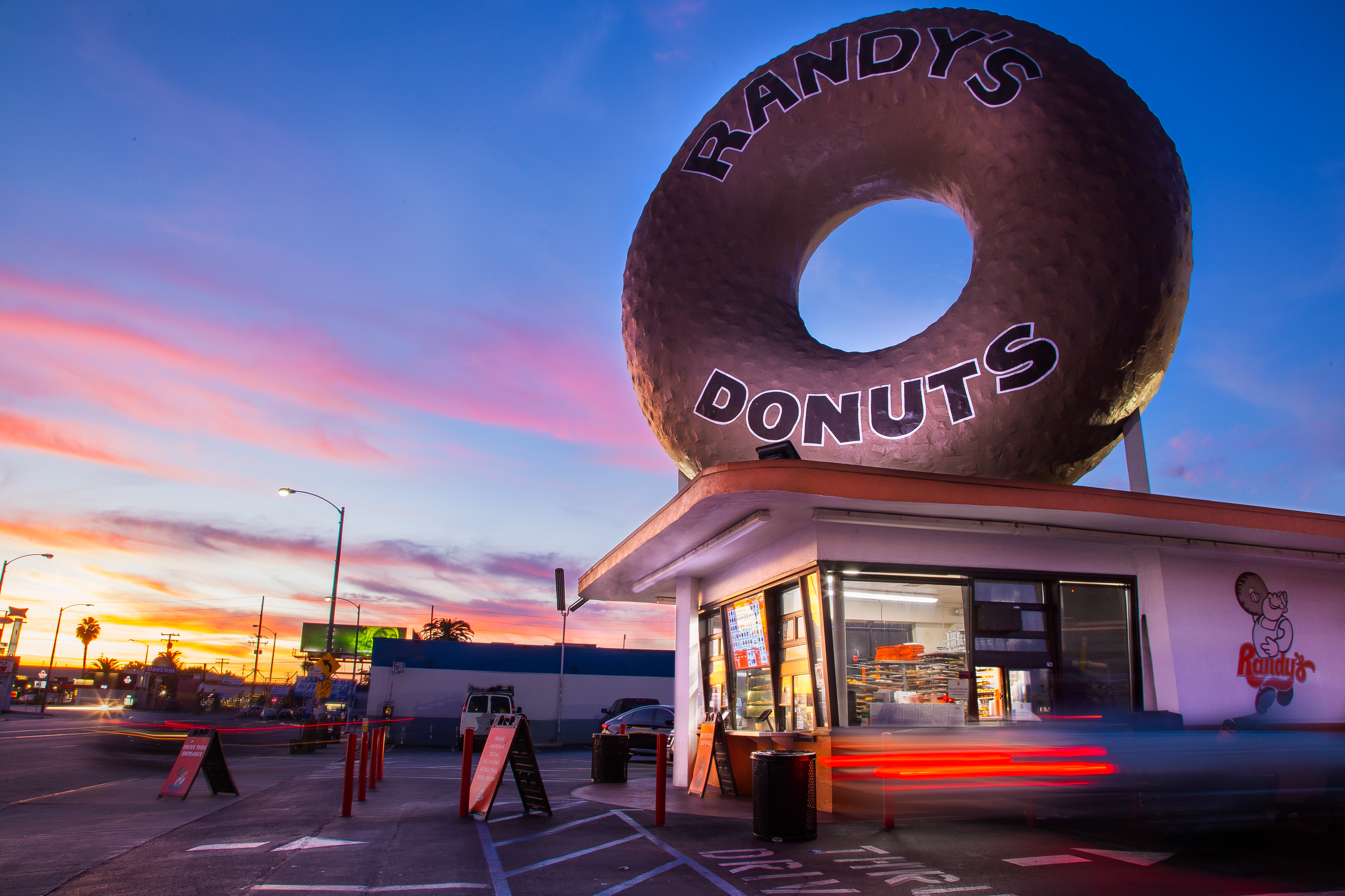 A giant doughnut hovers on top of a building at Randy’s Donuts in Inglewood, California.