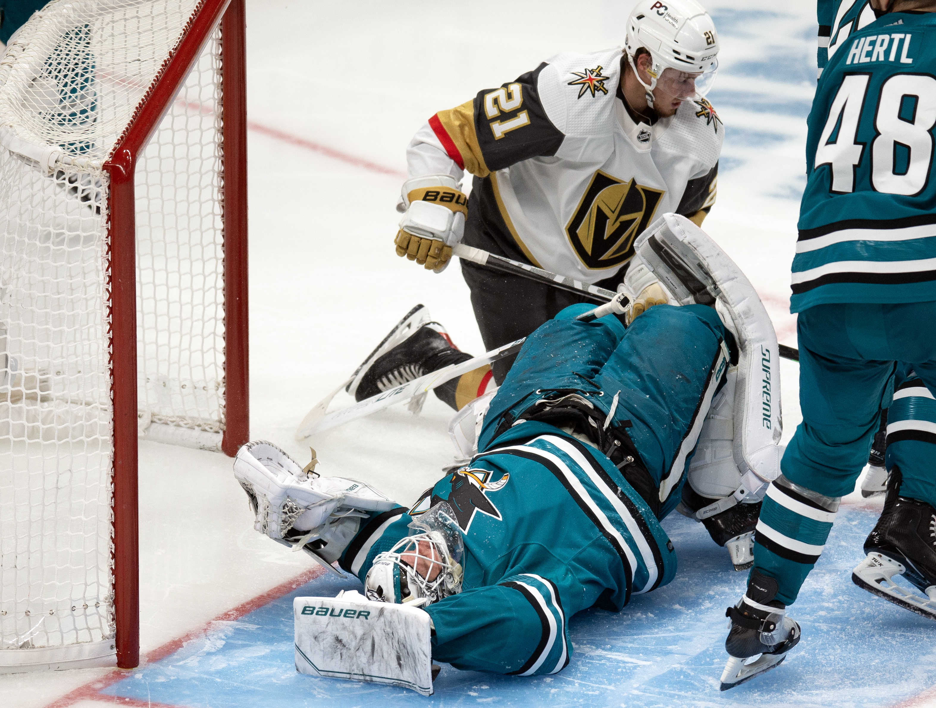 San Jose Sharks goaltender James Reimer (47) lays out on the ice after a collision with Las Vegas Golden Knights center Brett Howden (21) during the third period at SAP Center at San Jose. Howden was penalized for goalie interference.