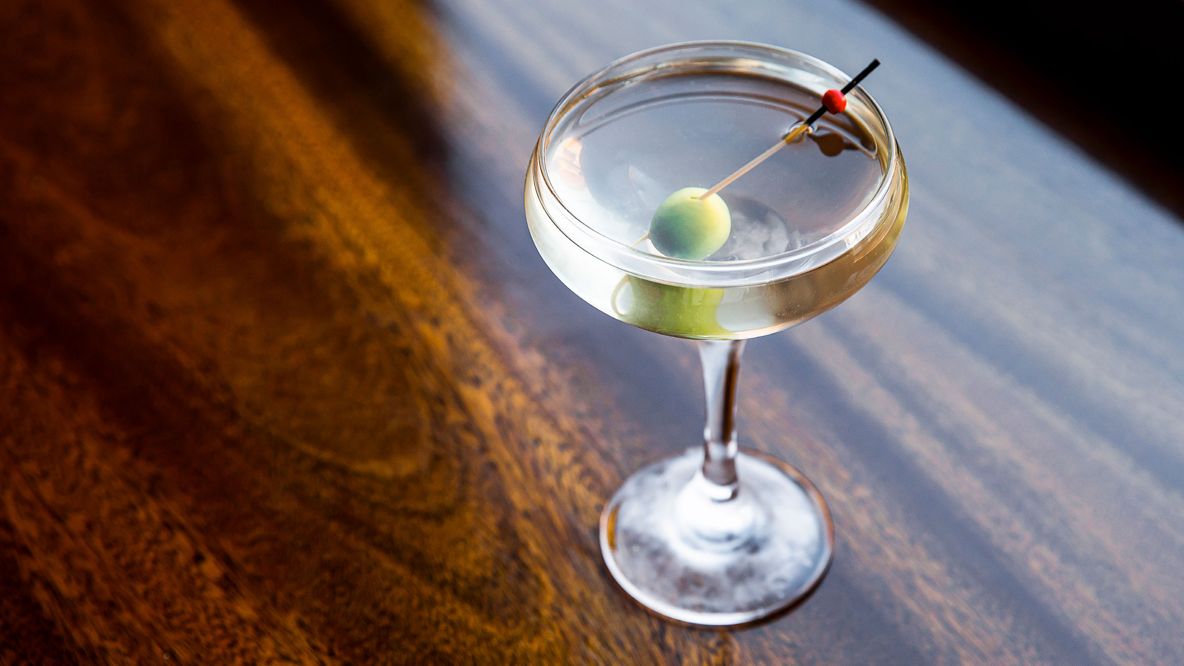 A martini with an olive