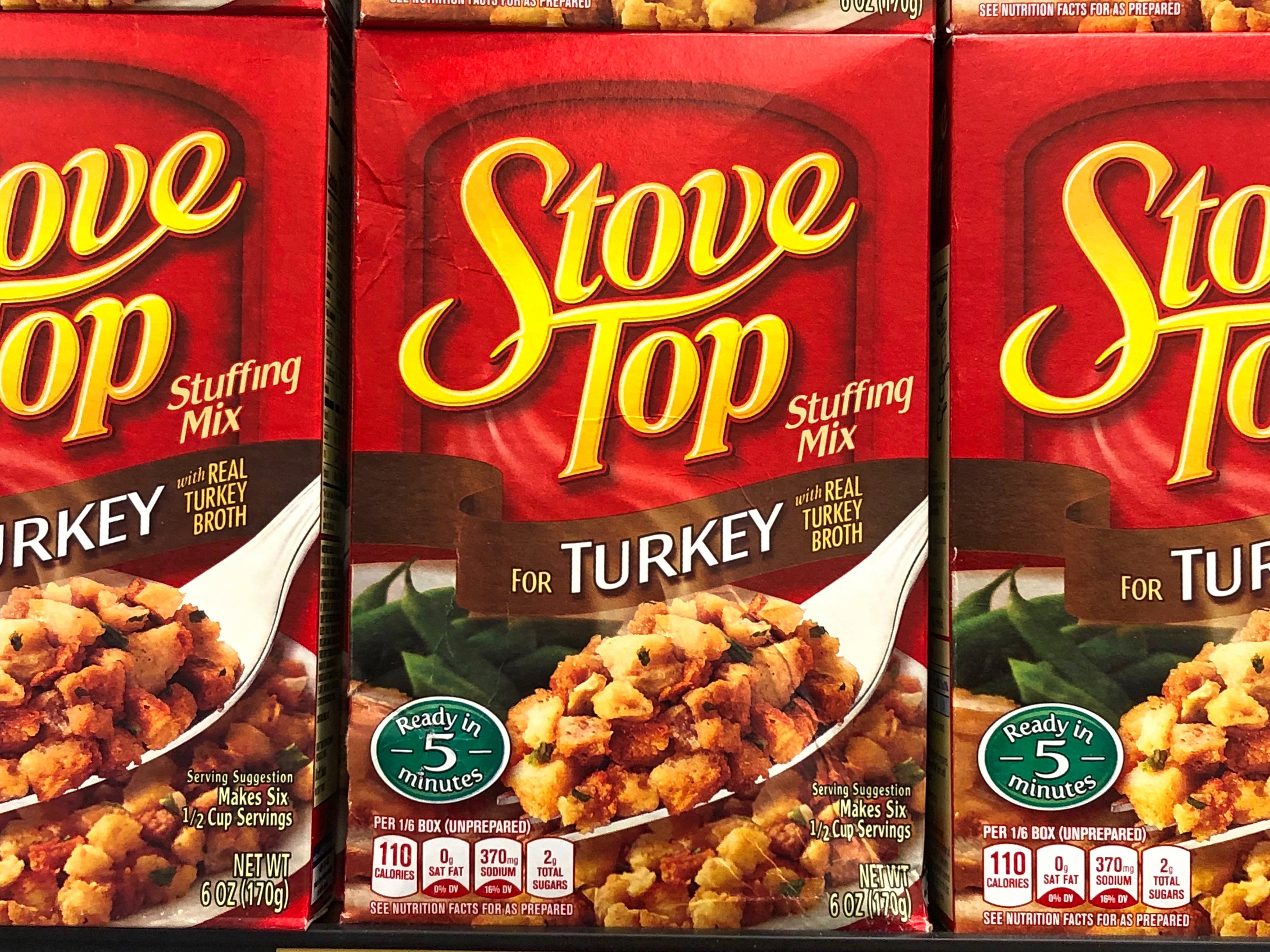 A closeup on three boxes of Stove Top stuffing