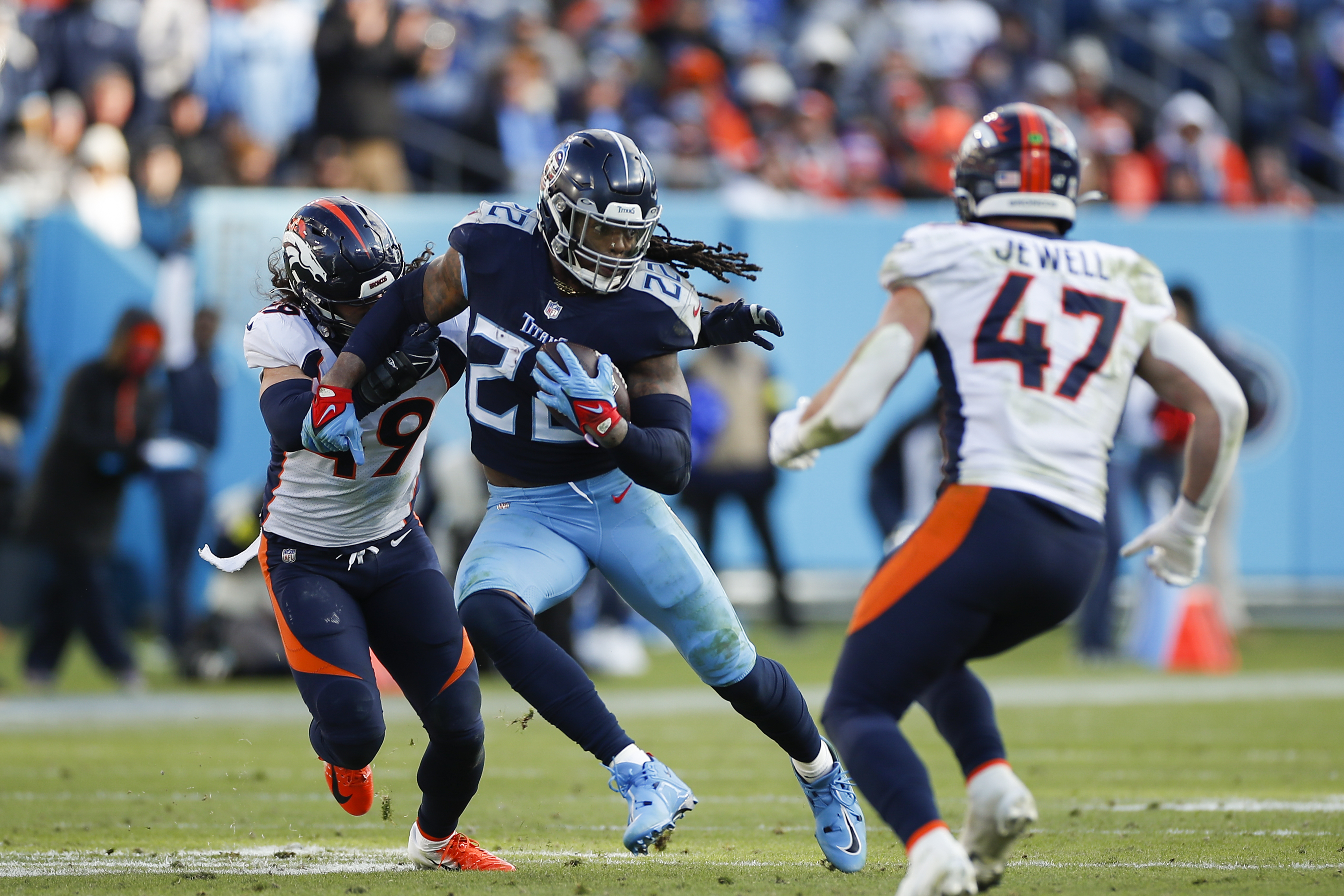 Running back Derrick Henry #22 of the Tennessee Titans rushes with the ball against the Denver Broncosat Nissan Stadium on November 13, 2022 in Nashville, Tennessee.