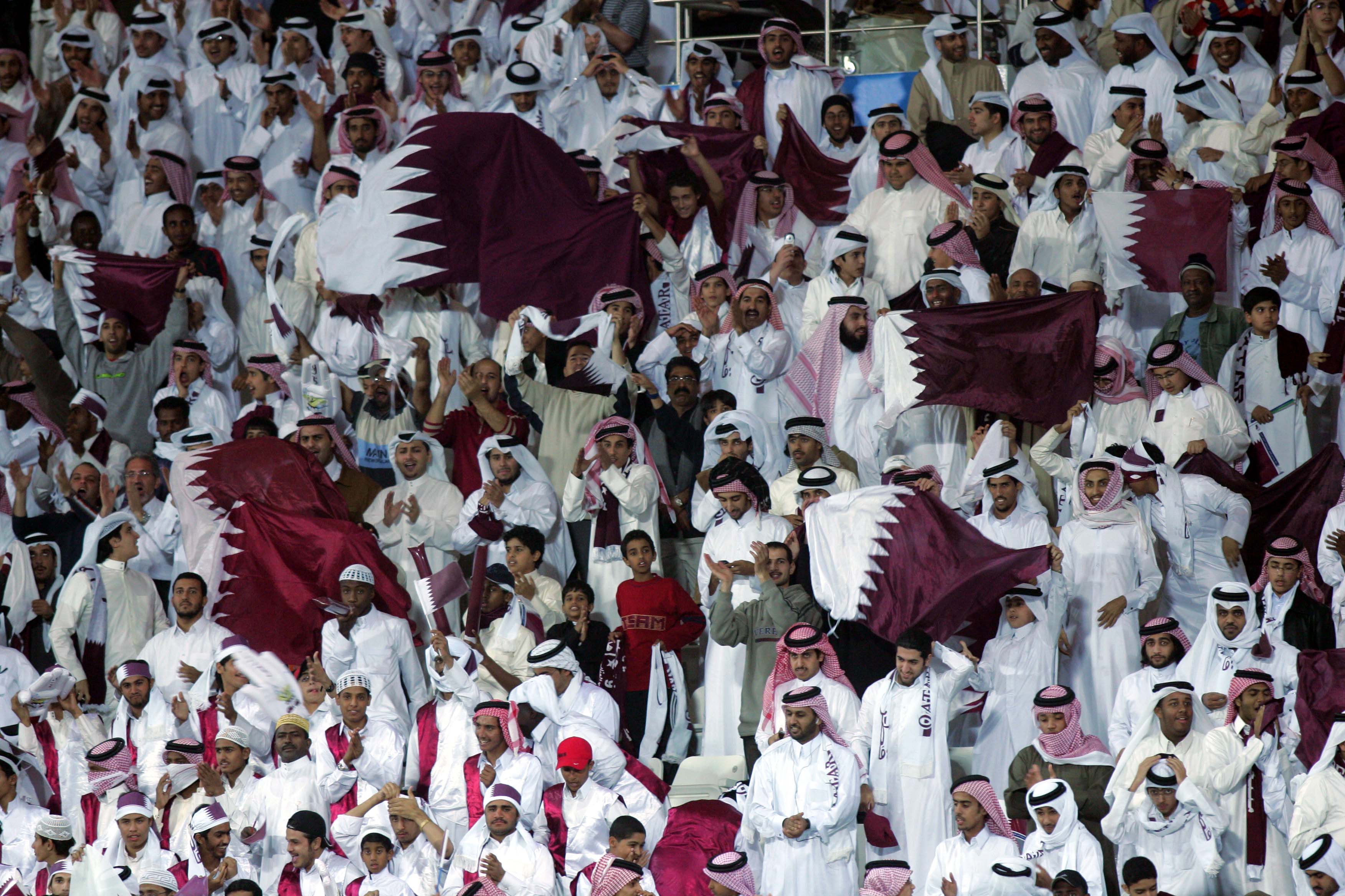 Qatari fans wave national flags - Qatari national team - FIFA World Cup 2022