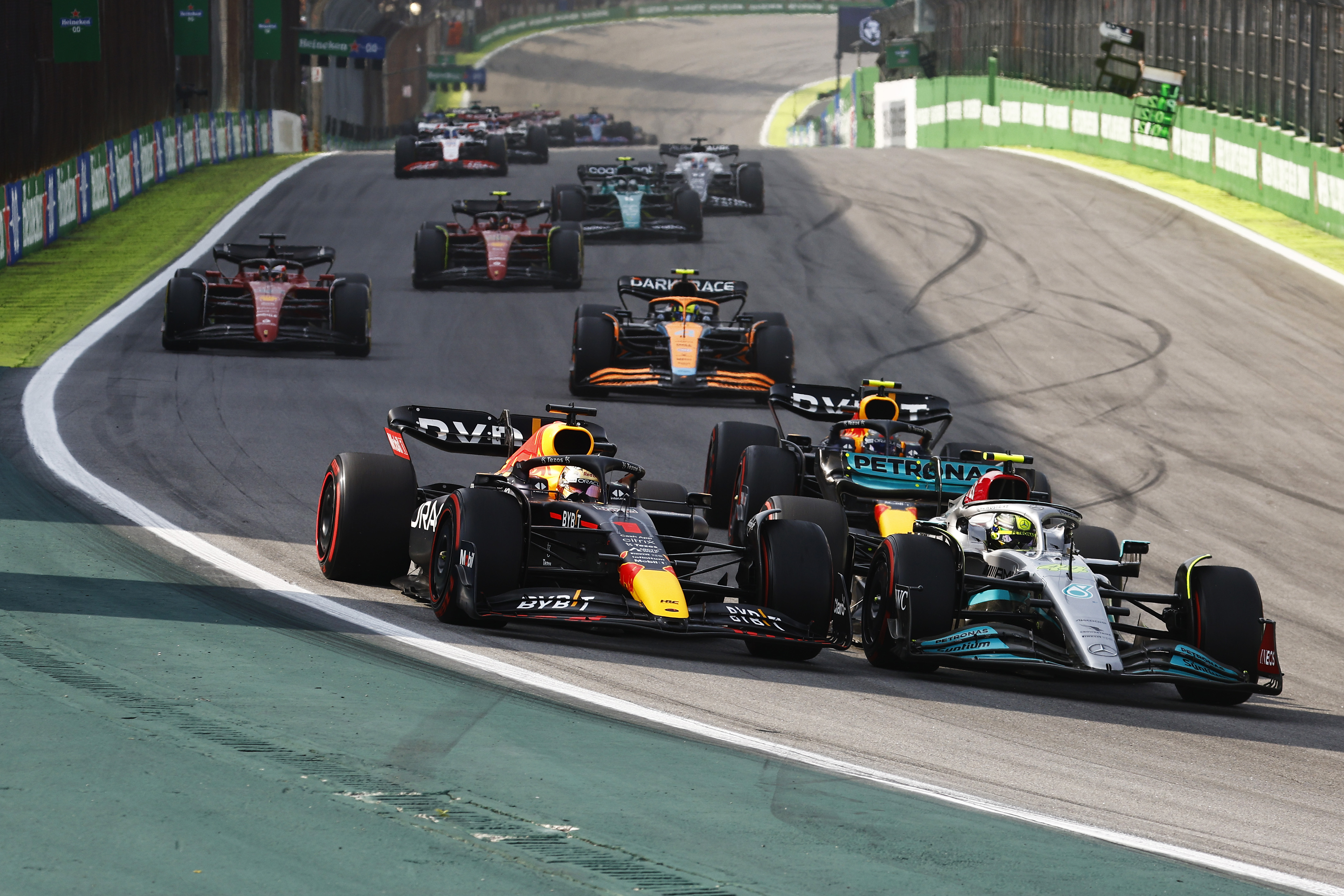 Max Verstappen of the Netherlands driving the (1) Oracle Red Bull Racing RB18 and Lewis Hamilton of Great Britain driving the (44) Mercedes AMG Petronas F1 Team W13 battle for track position during the F1 Grand Prix of Brazil at Autodromo Jose Carlos Pace on November 13, 2022 in Sao Paulo, Brazil.