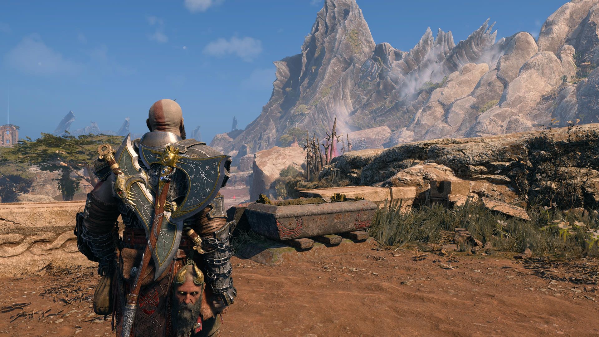 Kratos looks at a mountain in Vanaheim while wearing the Steinbjorn armor in God of War Ragnarok.