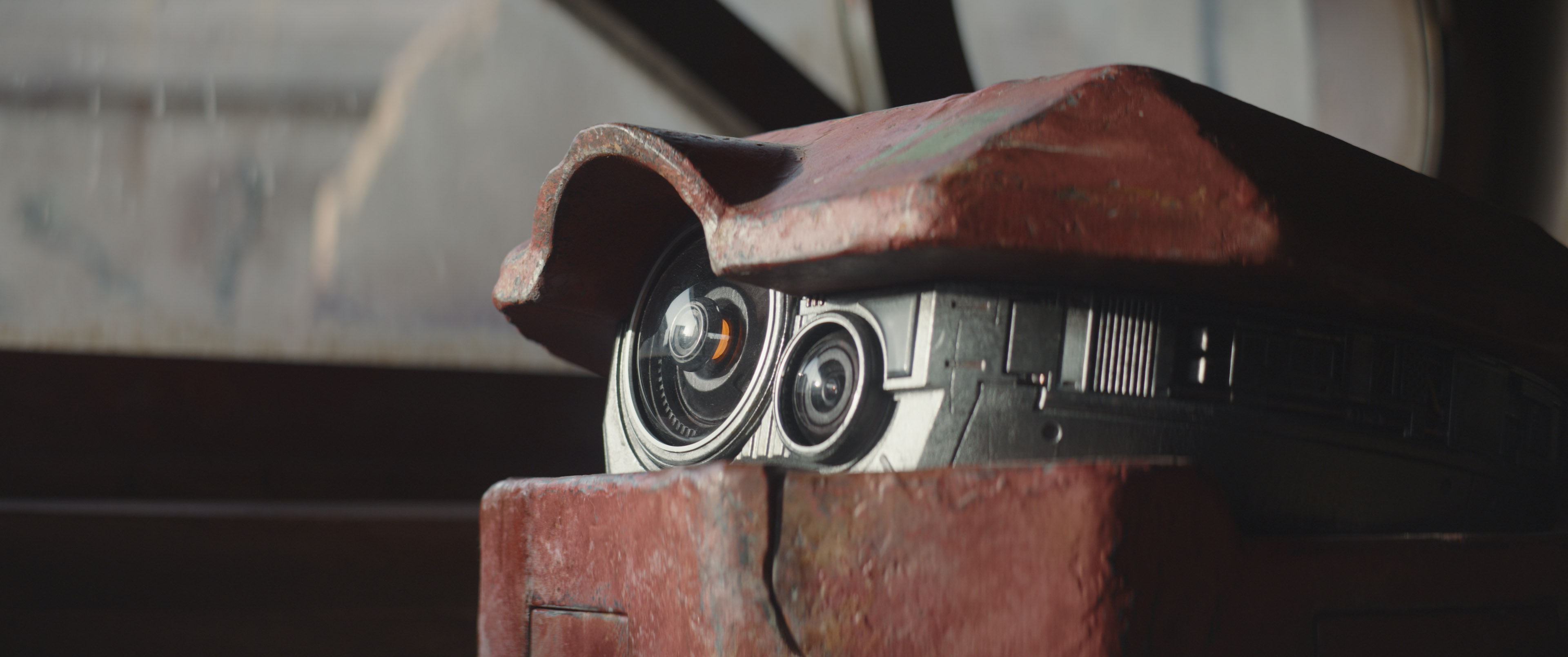 The adorable droid B2EMO in Andor: red, round, and boxy.