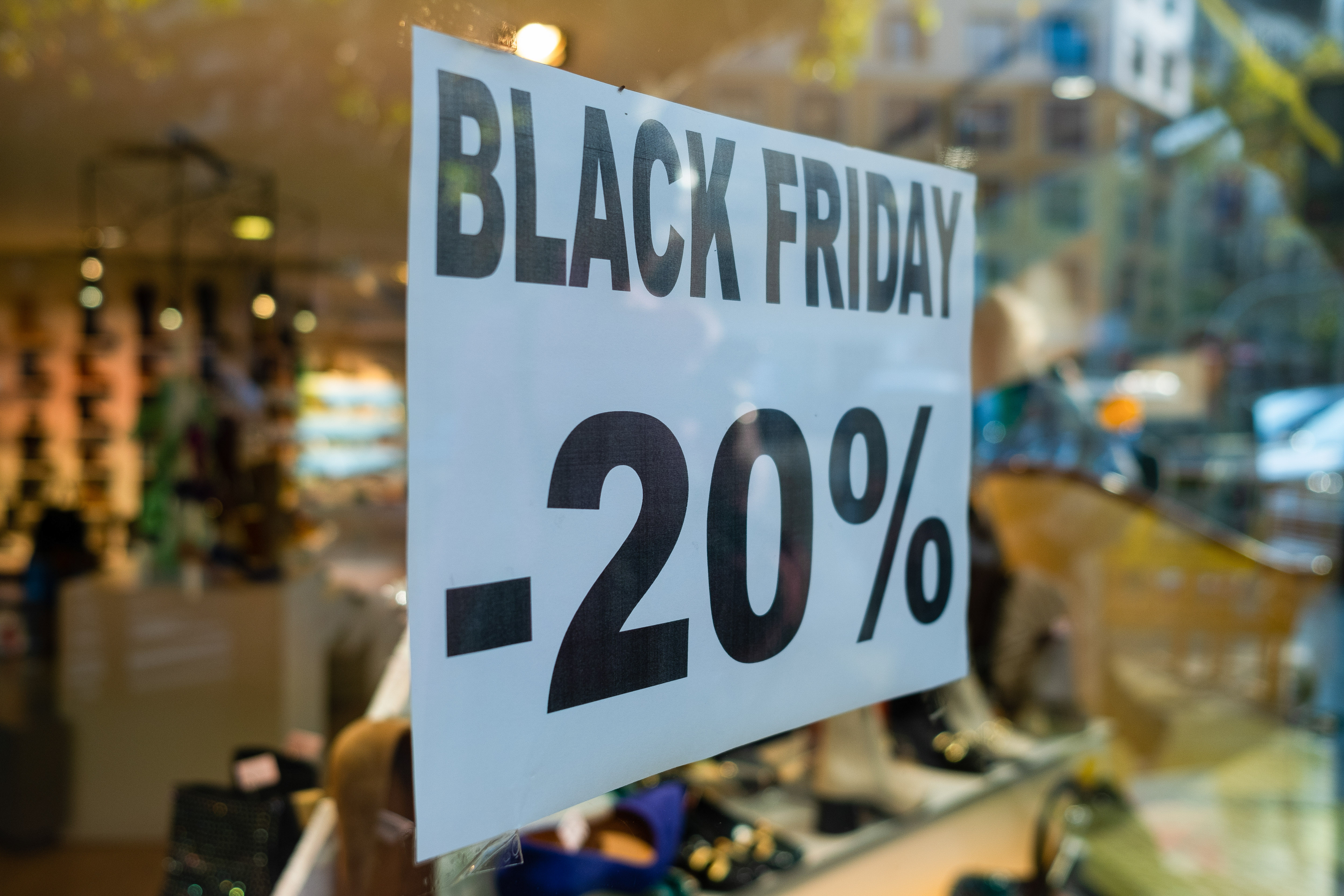 A Black Friday sign offering a 20% discount is seen in a...