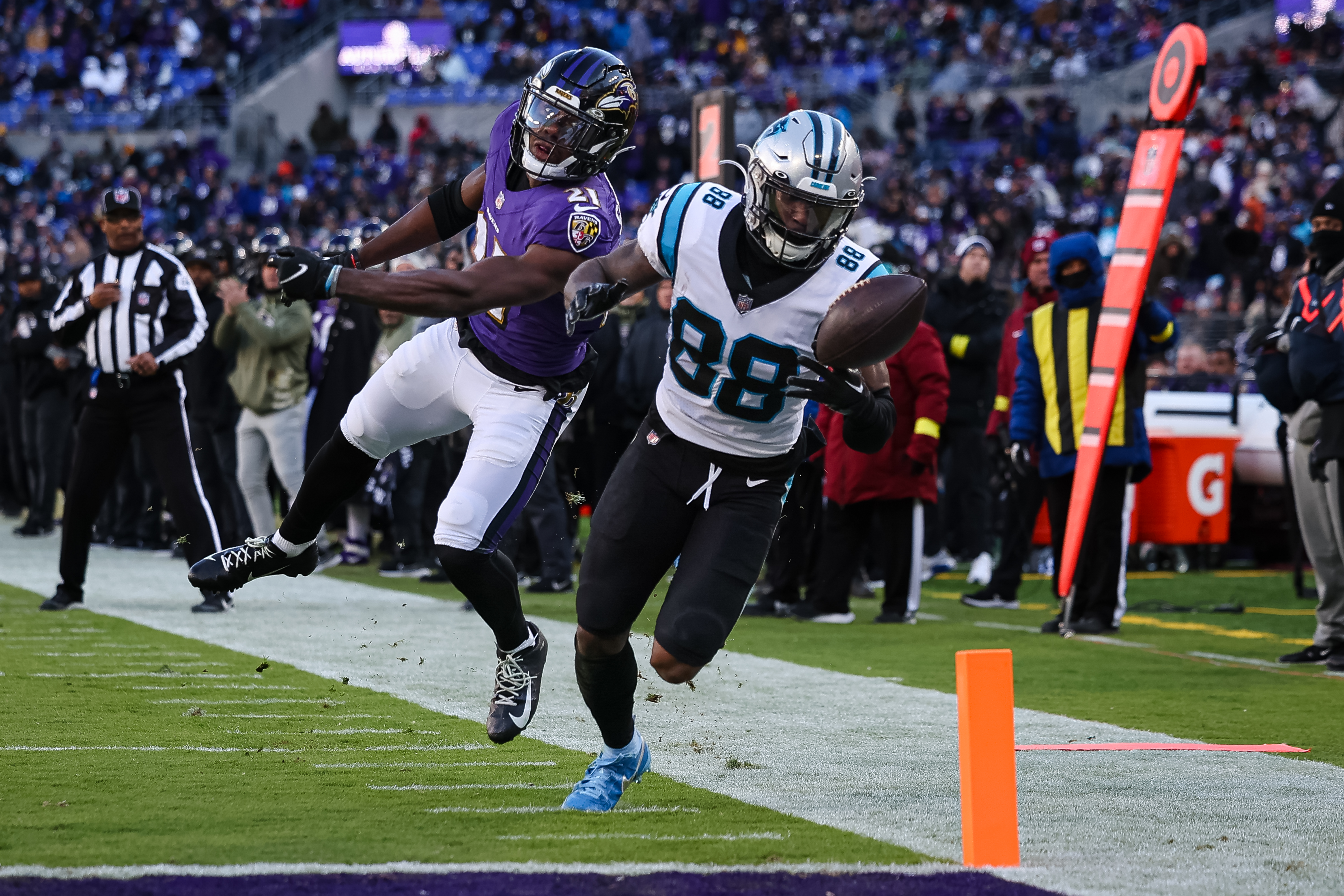 Brandon Stephens #21 of the Baltimore Ravens defends a pass intended for Terrace Marshall Jr. #88 of the Carolina Panthers during the second half at M&amp;T Bank Stadium on November 20, 2022 in Baltimore, Maryland.