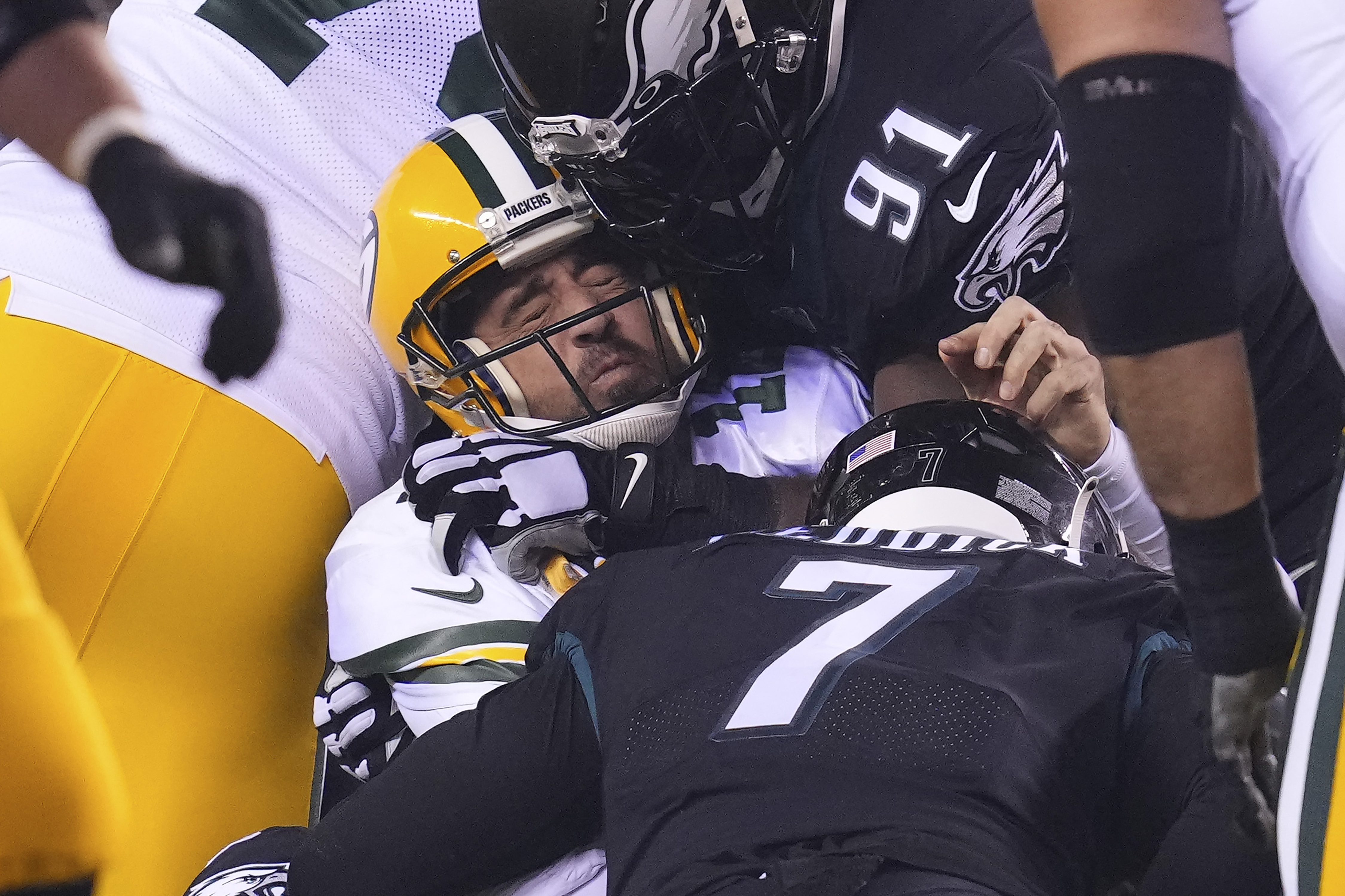Aaron Rodgers #12 of the Green Bay Packers is sacked by Brandon Graham #55 of the Philadelphia Eagles during the third quarter at Lincoln Financial Field on November 27, 2022 in Philadelphia, Pennsylvania.