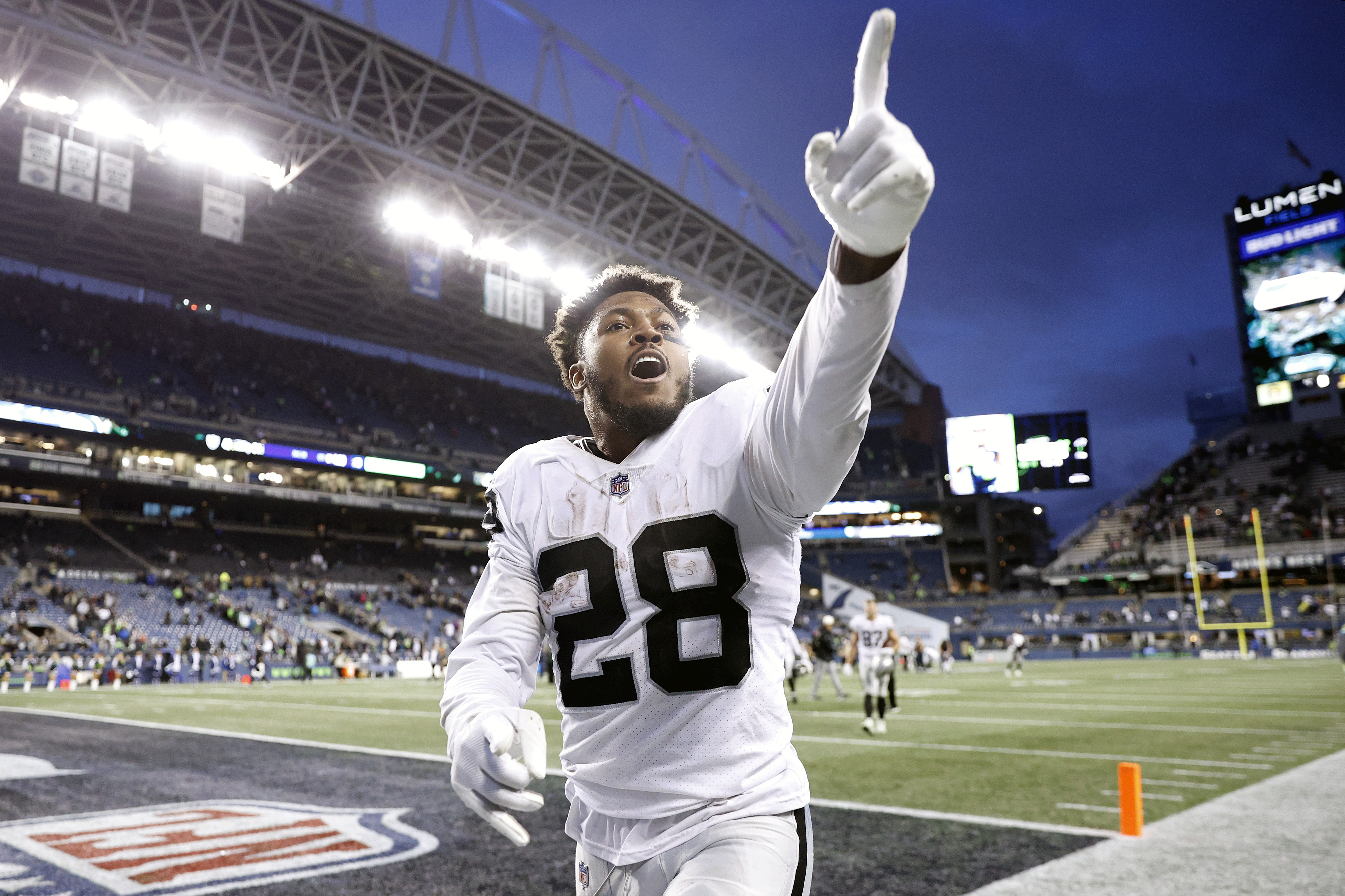 Josh Jacobs #28 of the Las Vegas Raiders celebrates after beating the Seattle Seahawks 40-34 in overtime at Lumen Field on November 27, 2022 in Seattle, Washington.