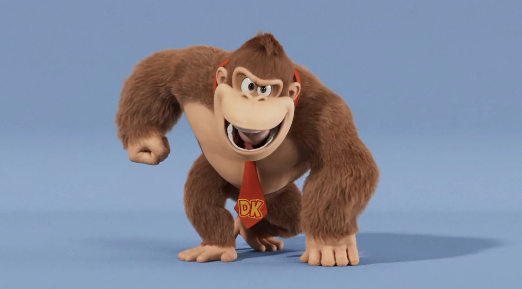 Donkey Kong as he appears in The Super Mario Bros. Movie. He looks like Donkey Kong normally does, with a red necktie — but his face is narrower and more mischievous. Perhaps...evil
