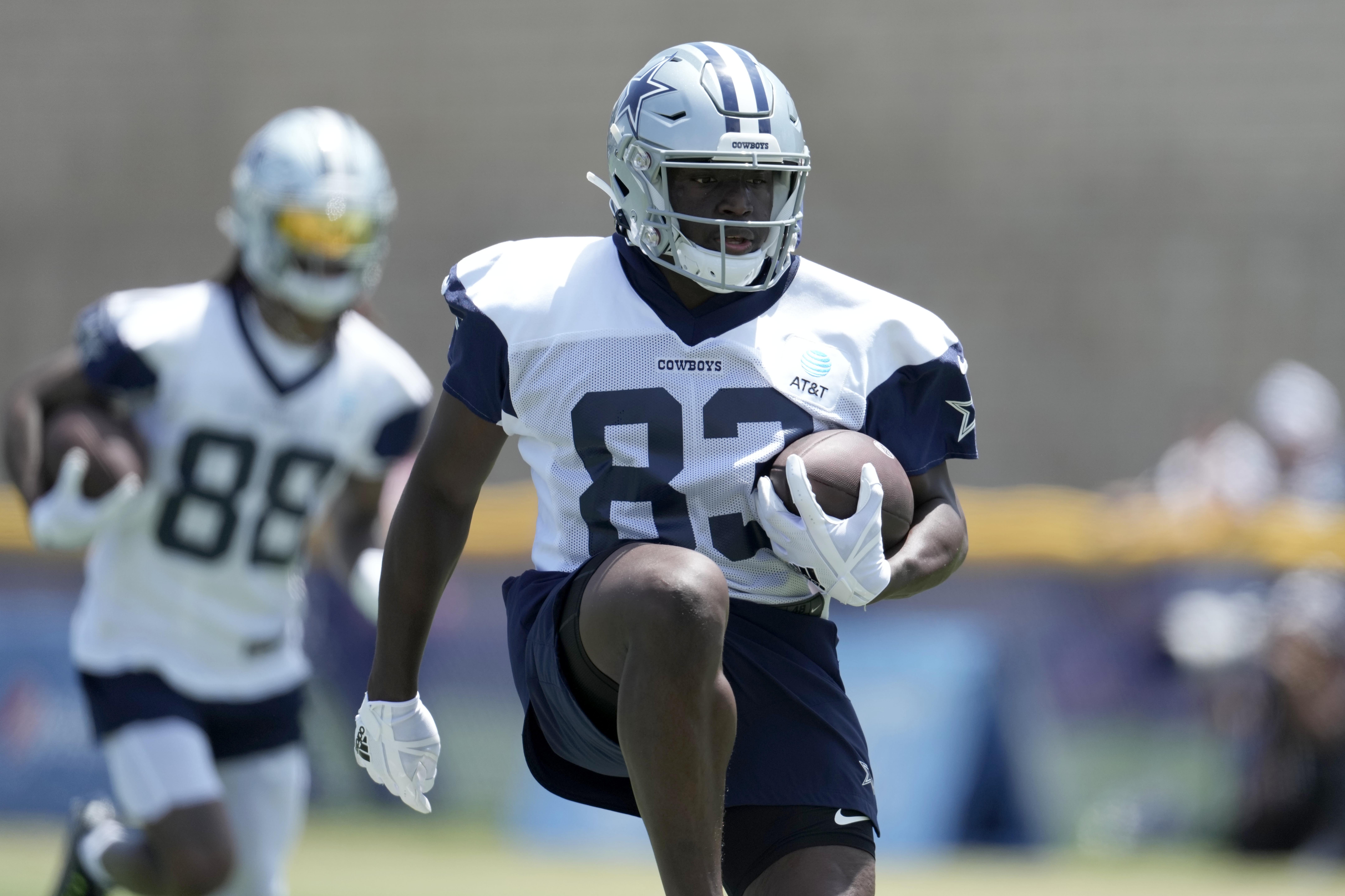 Dallas Cowboys receiver James Washington (83) carries the ball during training camp at the River Ridge Fields.&nbsp;