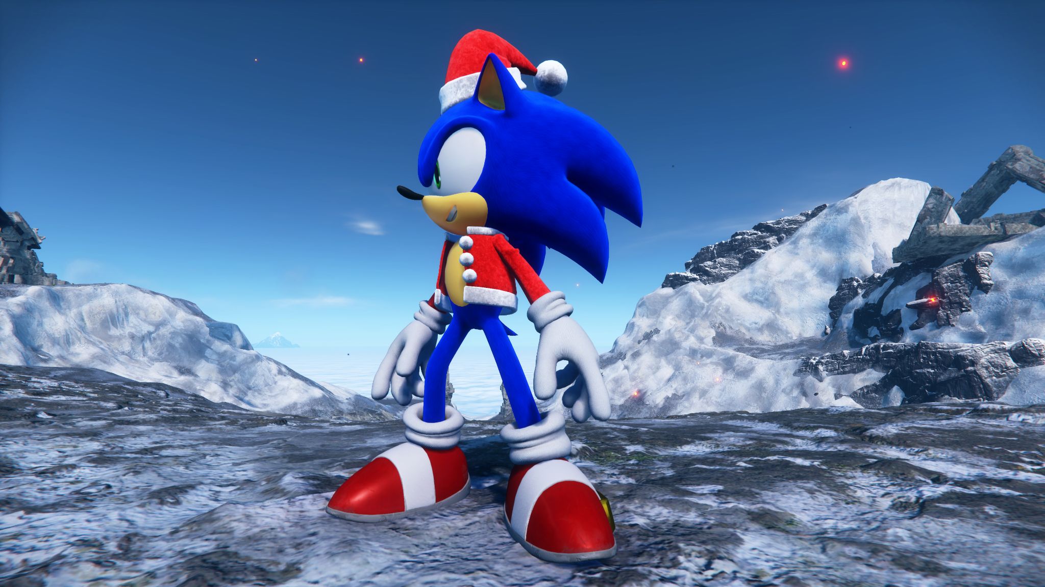 An image of Sonic the Hedgehog wearing a Christmas hat and jacket. He’s standing on top of a snowy mountain. 