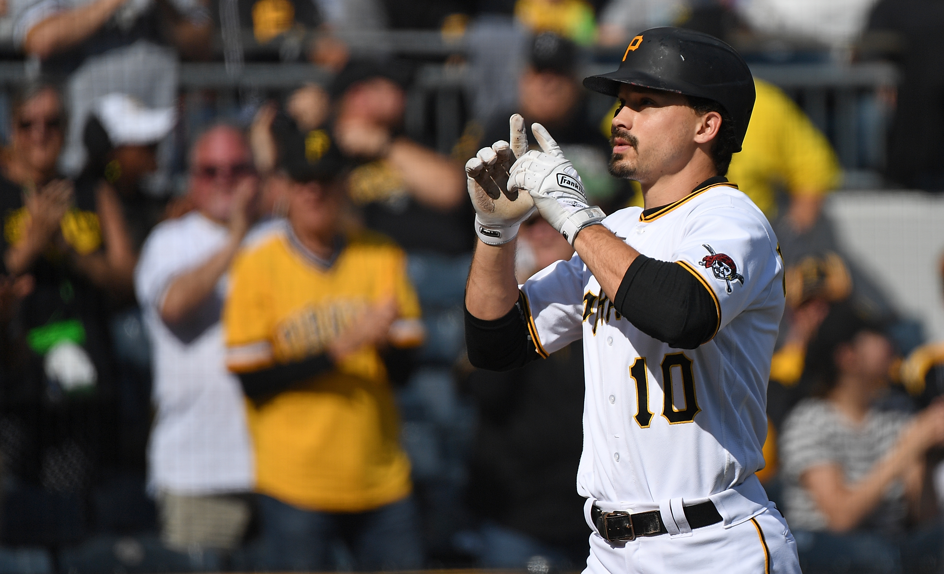 Bryan Reynolds of the Pittsburgh Pirates reacts as he crosses home plate after hitting a solo home run in the sixth inning during the game against the Chicago Cubs at PNC Park on September 25, 2022 in Pittsburgh, Pennsylvania.