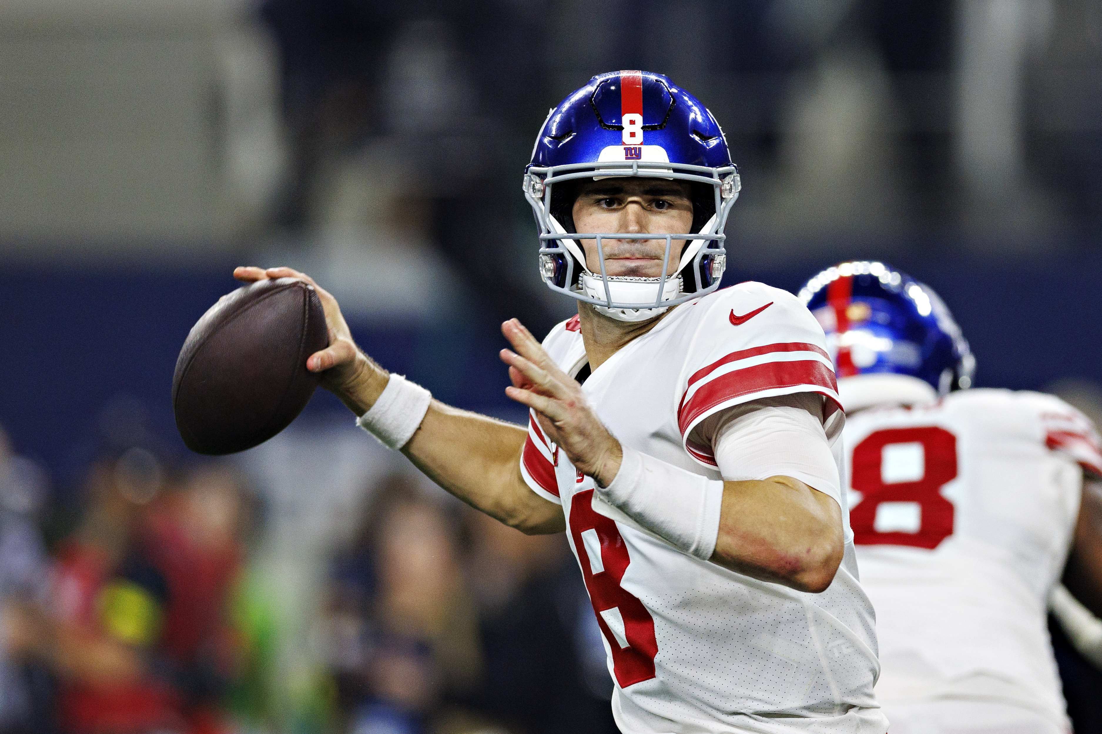 Daniel Jones #8 of the New York Giants throws a pass during a game against the Dallas Cowboys at AT&amp;T Stadium on November 24, 2022 in Arlington, Texas. The Cowboys defeated the Giants 28-20.