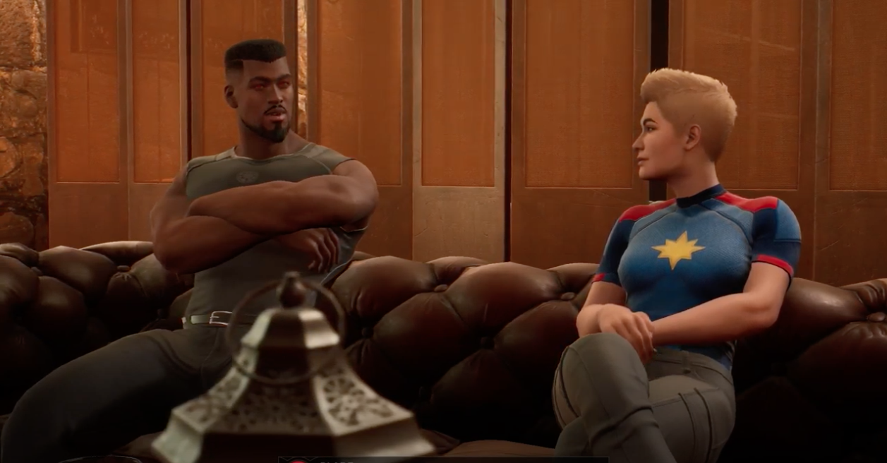 Scene from Marvel’s Midnight Suns where Blade and Captain Marvel are seated on a couch discussing the latest title for Blade’s book club