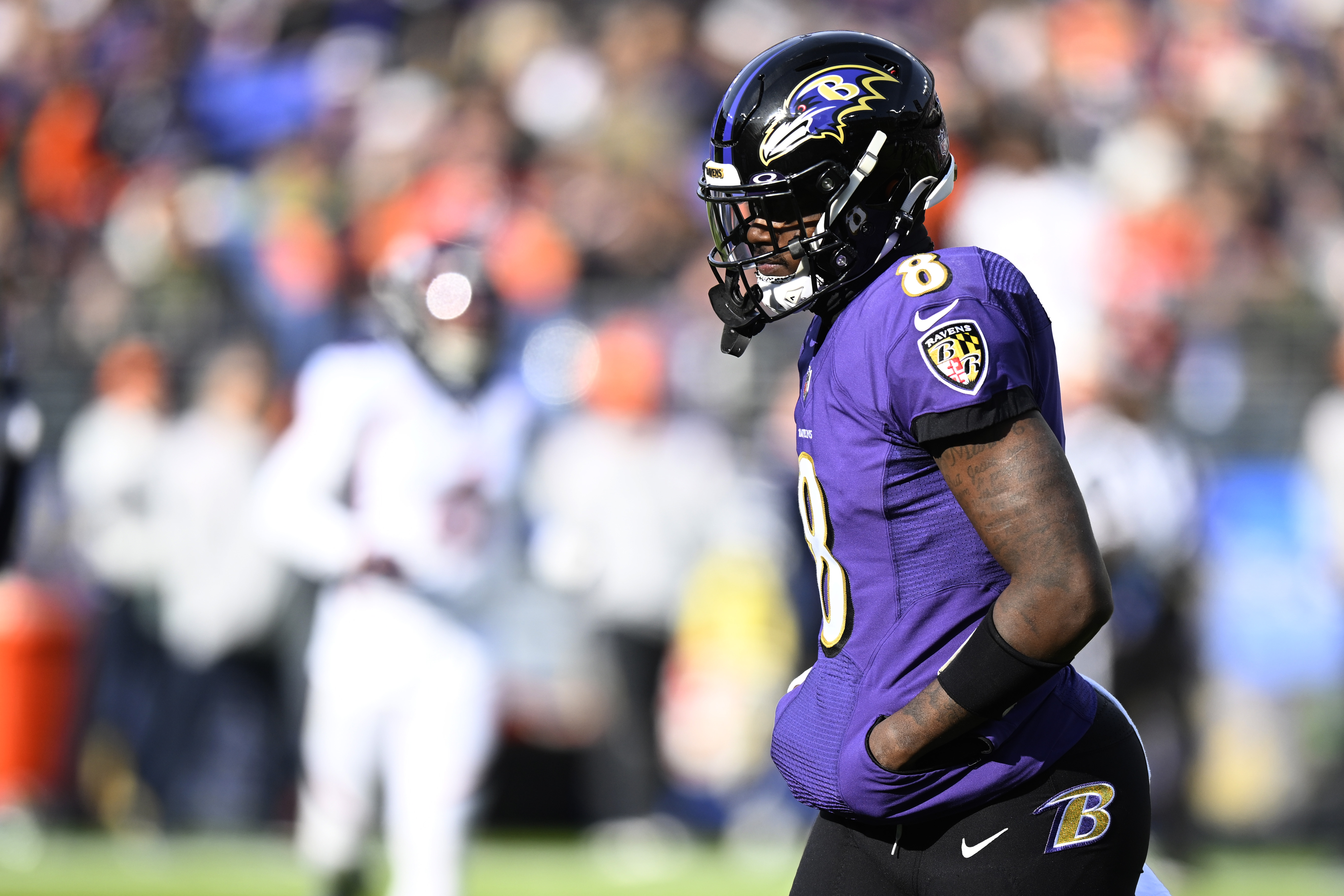 Lamar Jackson #8 of the Baltimore Ravens looks on in the first quarter of a game against the Denver Broncos at M&amp;T Bank Stadium on December 04, 2022 in Baltimore, Maryland.