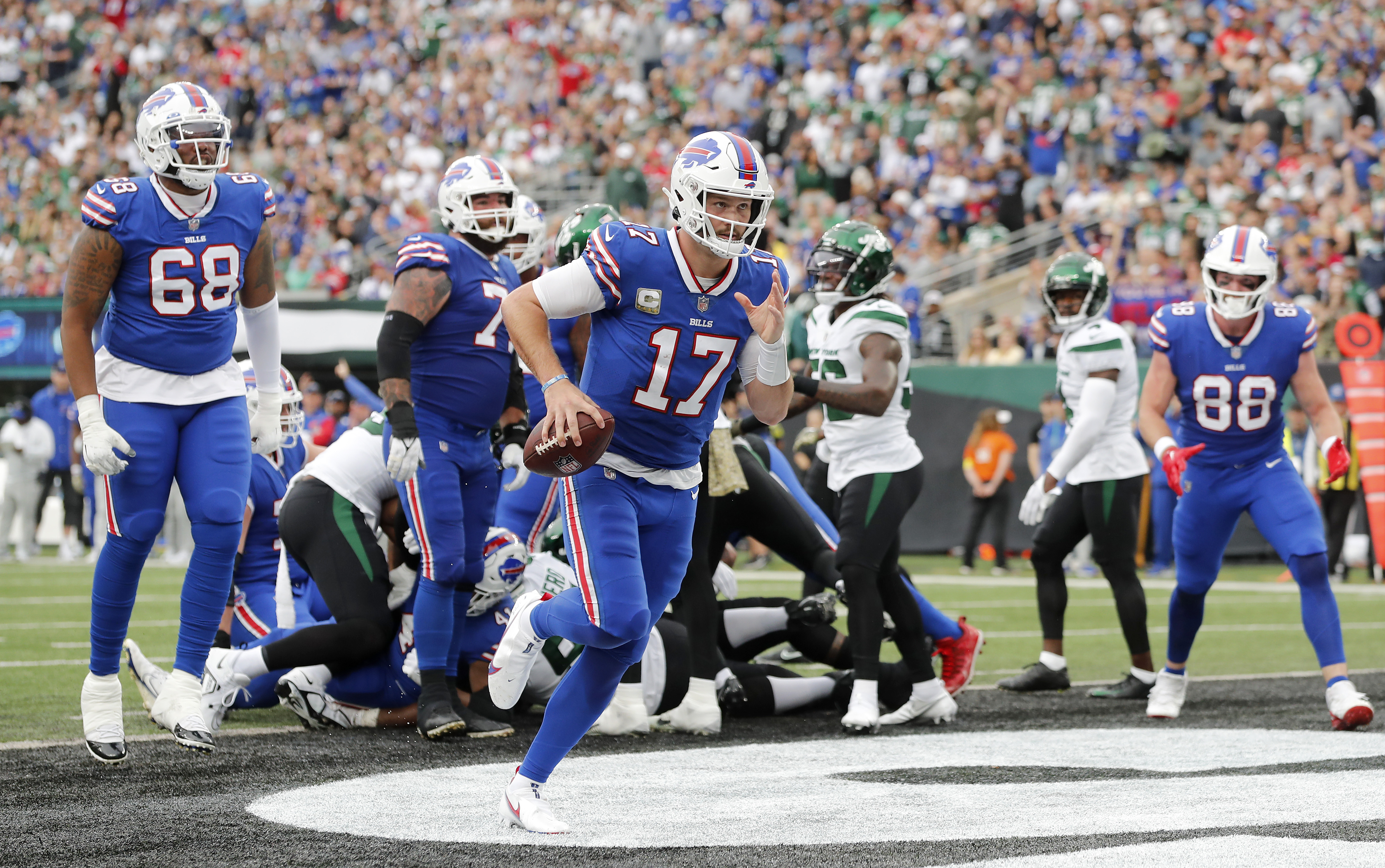 Josh Allen #17 of the Buffalo Bills runs in a touchdown against the New York Jets at MetLife Stadium on November 06, 2022 in East Rutherford, New Jersey.