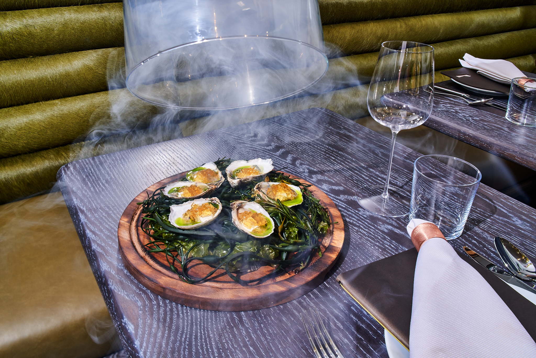 Oysters with cloche filled with smoke.