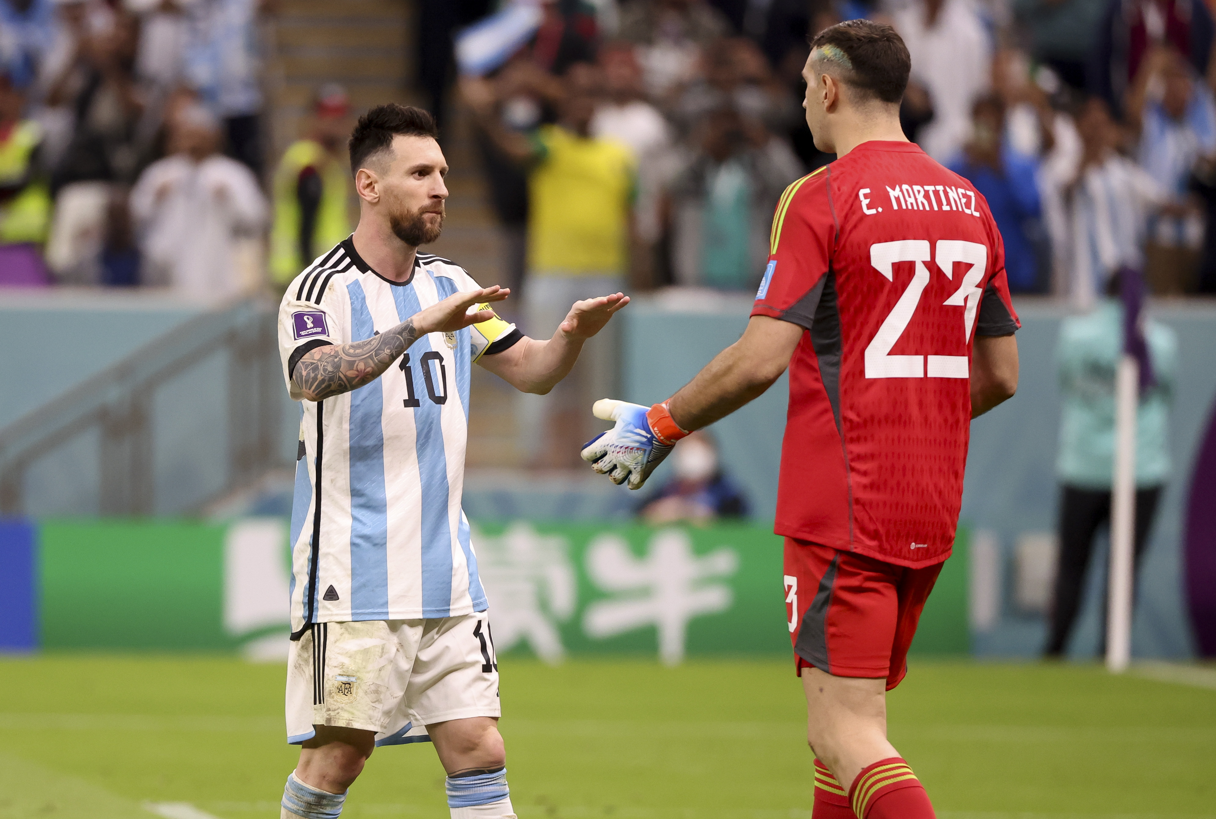 Lionel Messi celebrates with goalkeeper Emiliano Martinez - Argentina semifinal - FIFA World Cup Qatar 2022