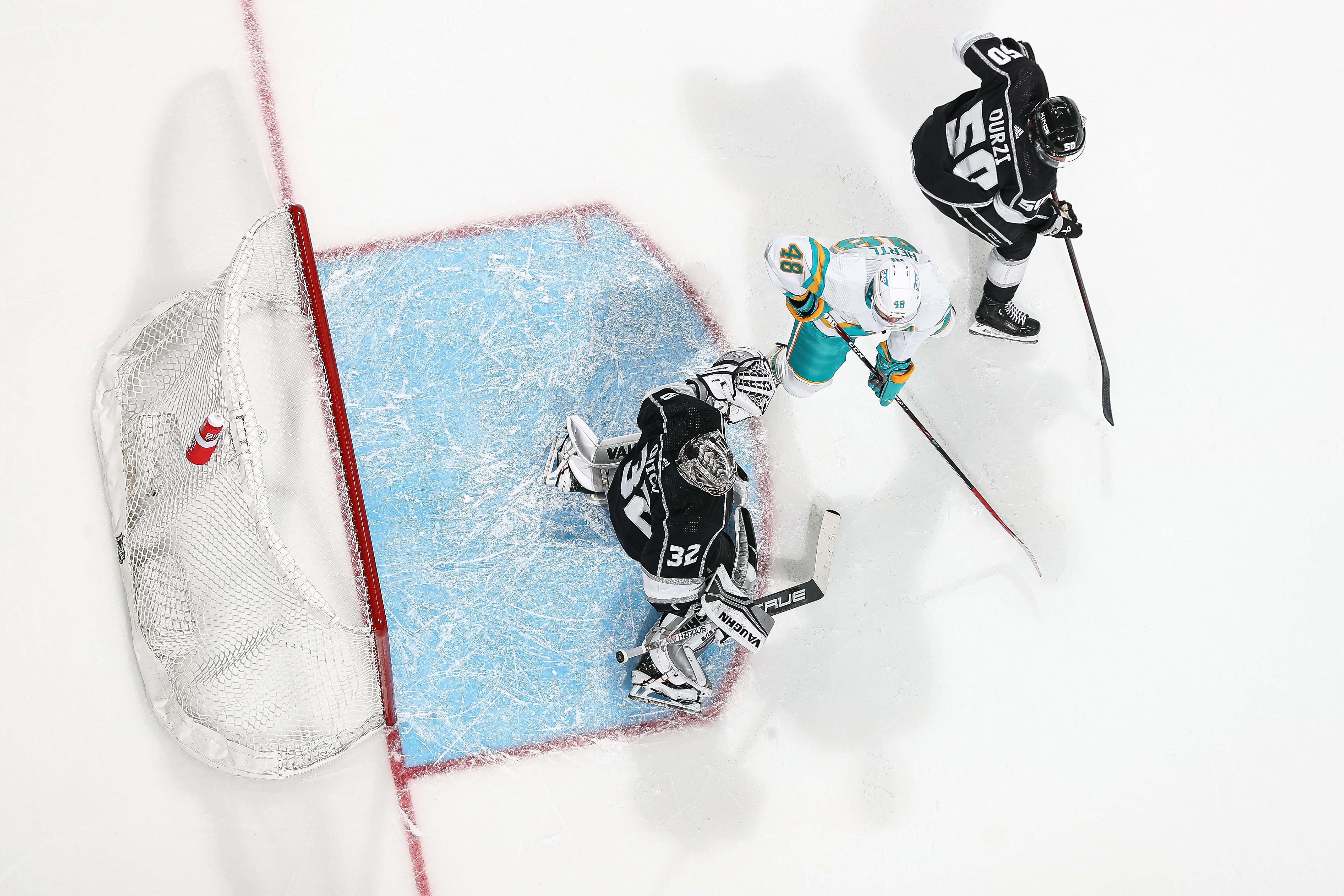 An overhead view as Jonathan Quick #32 of the Los Angeles Kings makes a save against Tomas Hertl #48 of the San Jose Sharks at SAP Center on November 25, 2022 in San Jose, California.