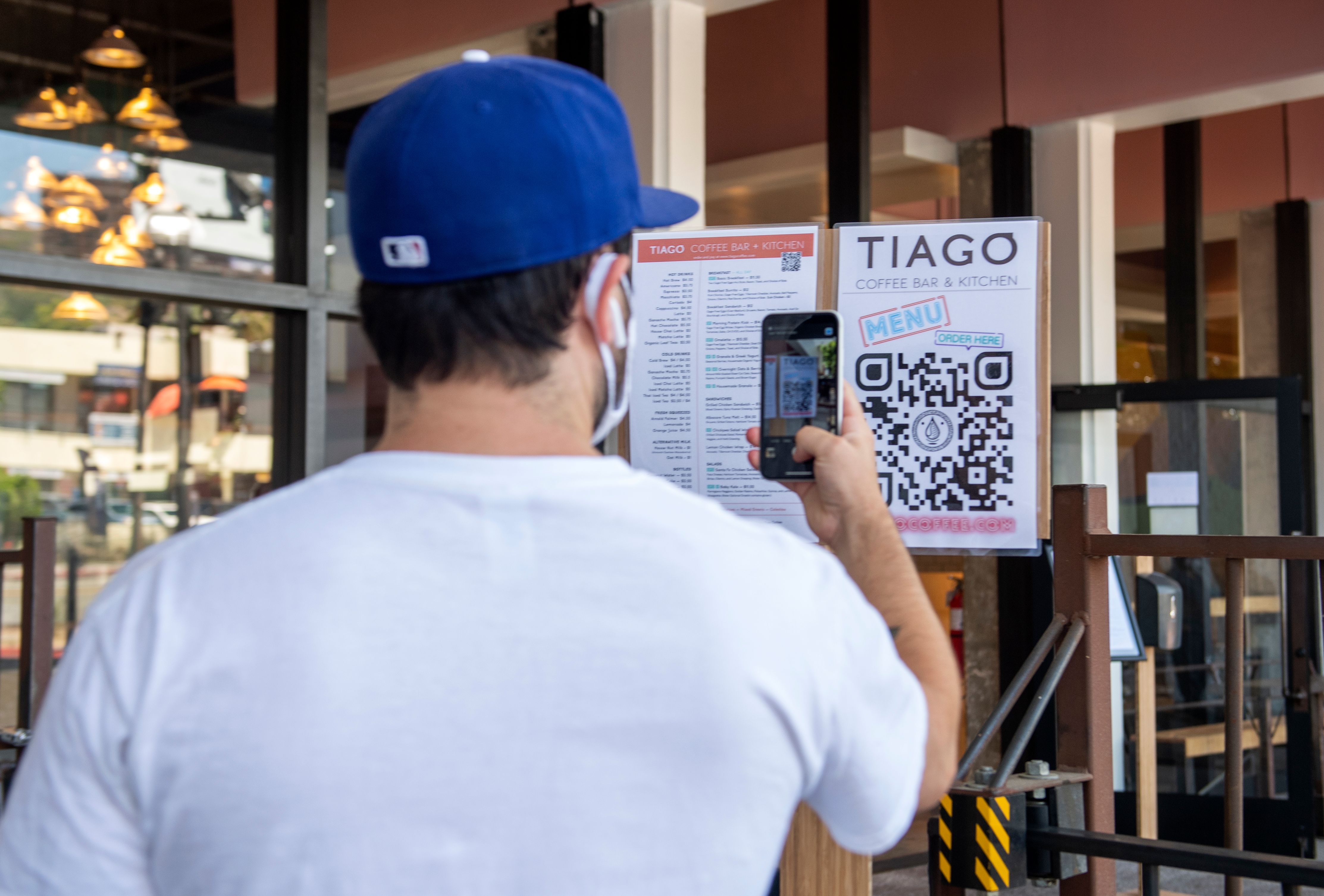 Customer scans a menu to place an order at Tiago Cafe in Hollywood.