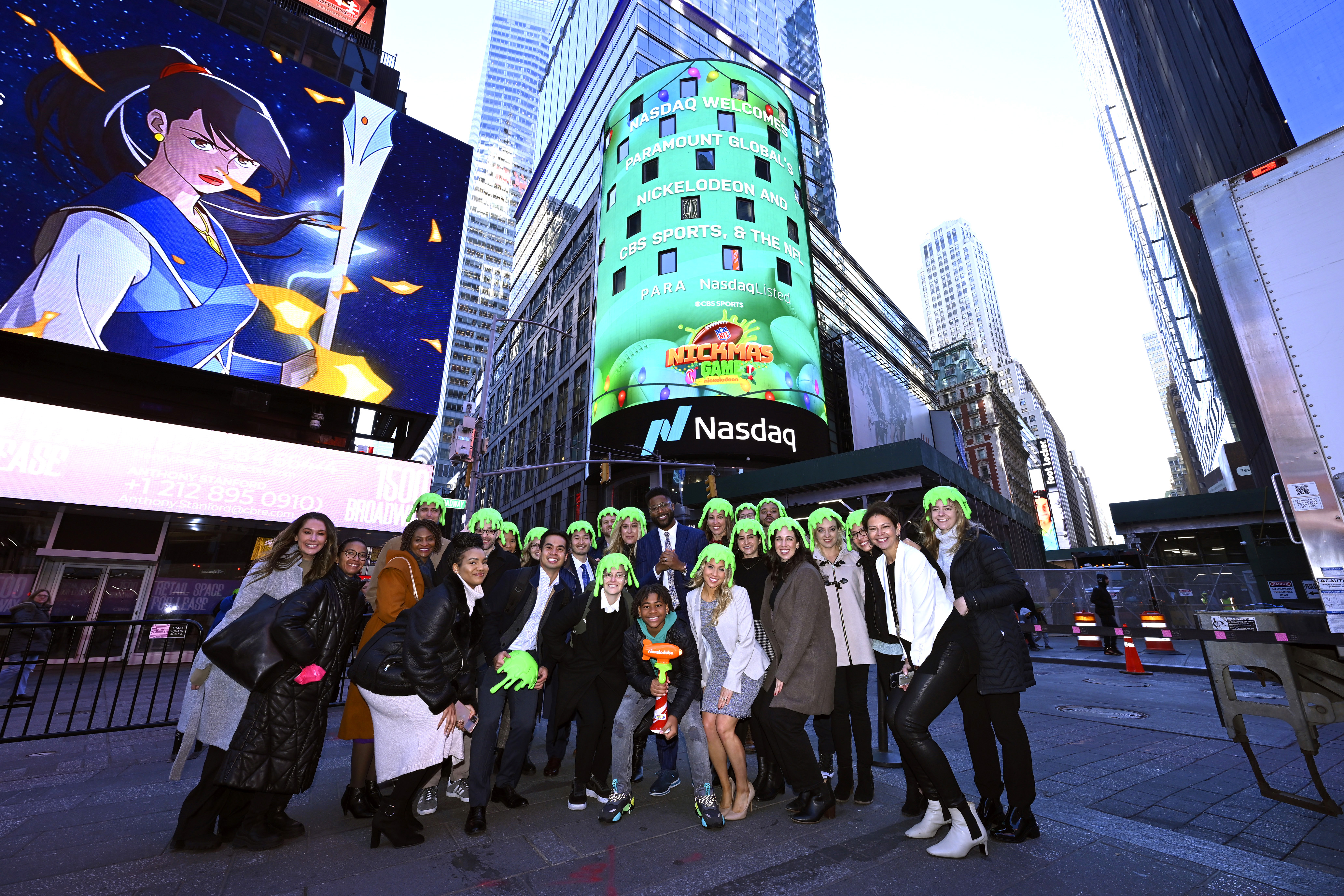Nate Burleson And Young Dylan, With Nickelodeon, CBS Sports And The NFL Ring The Nasdaq Opening Bell In Celebration Of the Nickelodeon NFL Nickmas Game At NASDAQ MarketSite