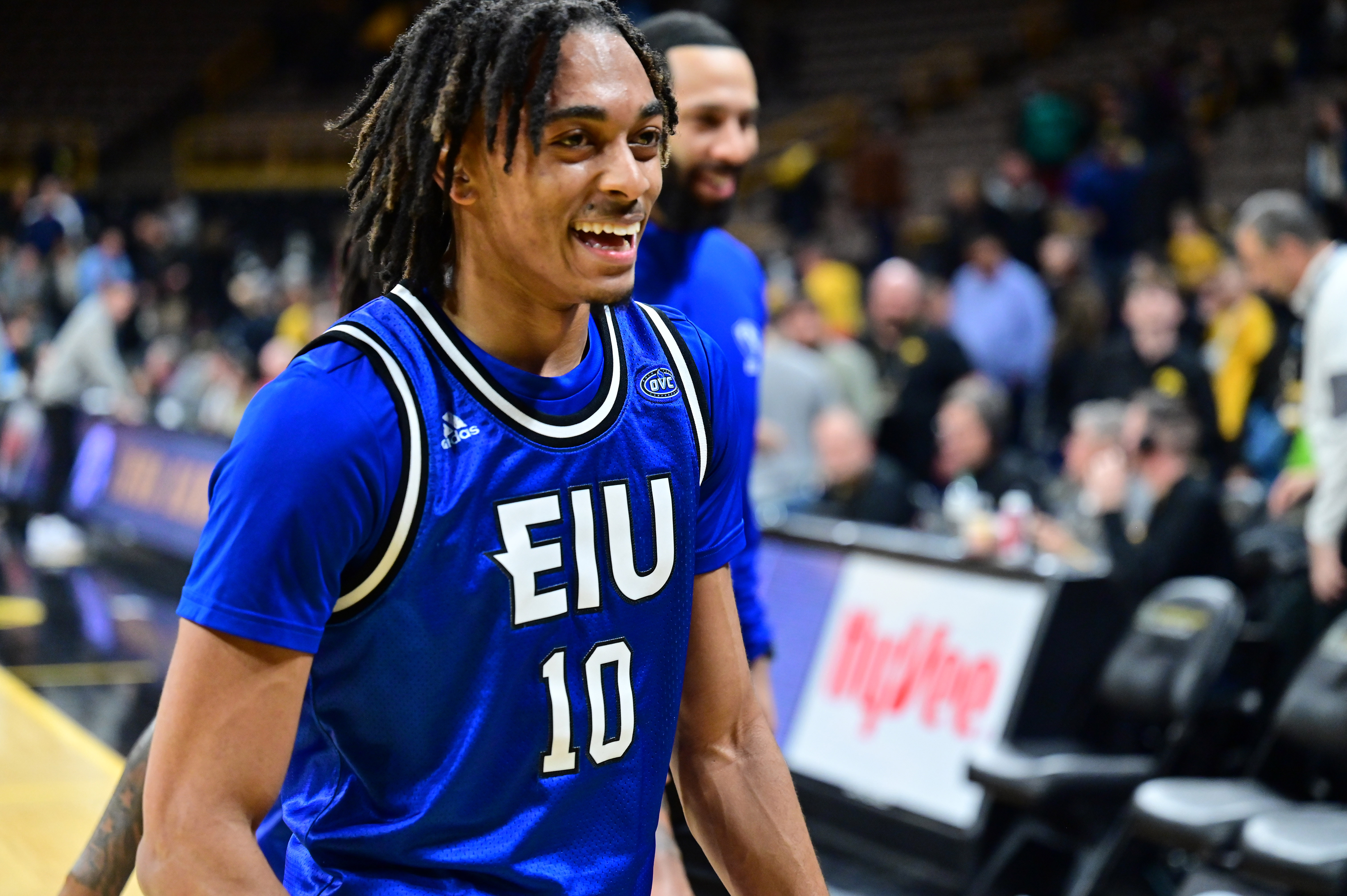IOWA CITY, IA - DECEMBER 21: Eastern Illinois guard Kenyon Hodges (10) flashes a big smile as he walks off of the court after winning a college basketball game between the Eastern Illinois Panthers and the Iowa Hawkeyes on December 21, 2022
