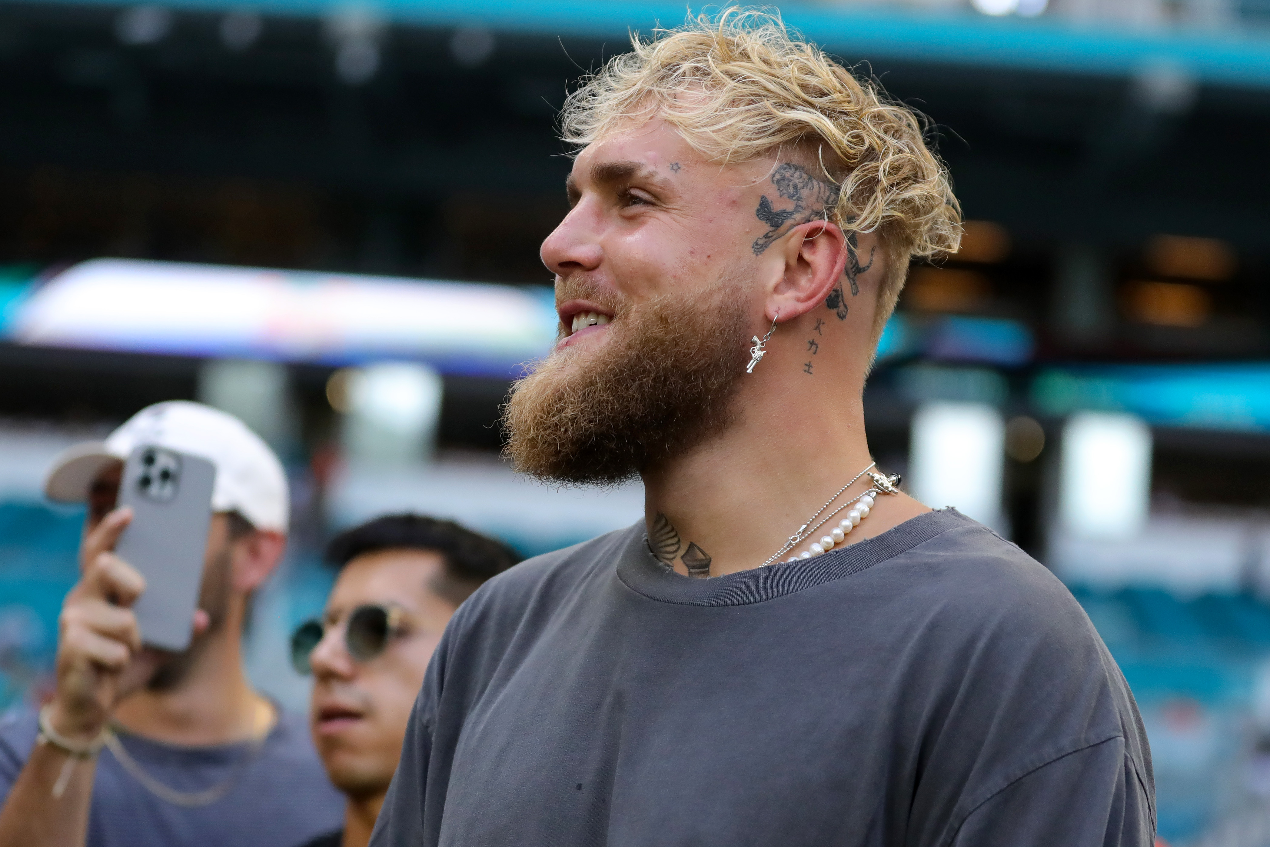 Jake Paul attends a game between the Houston Texans and Miami Dolphins at Hard Rock Stadium on November 27, 2022 in Miami Gardens, Florida.