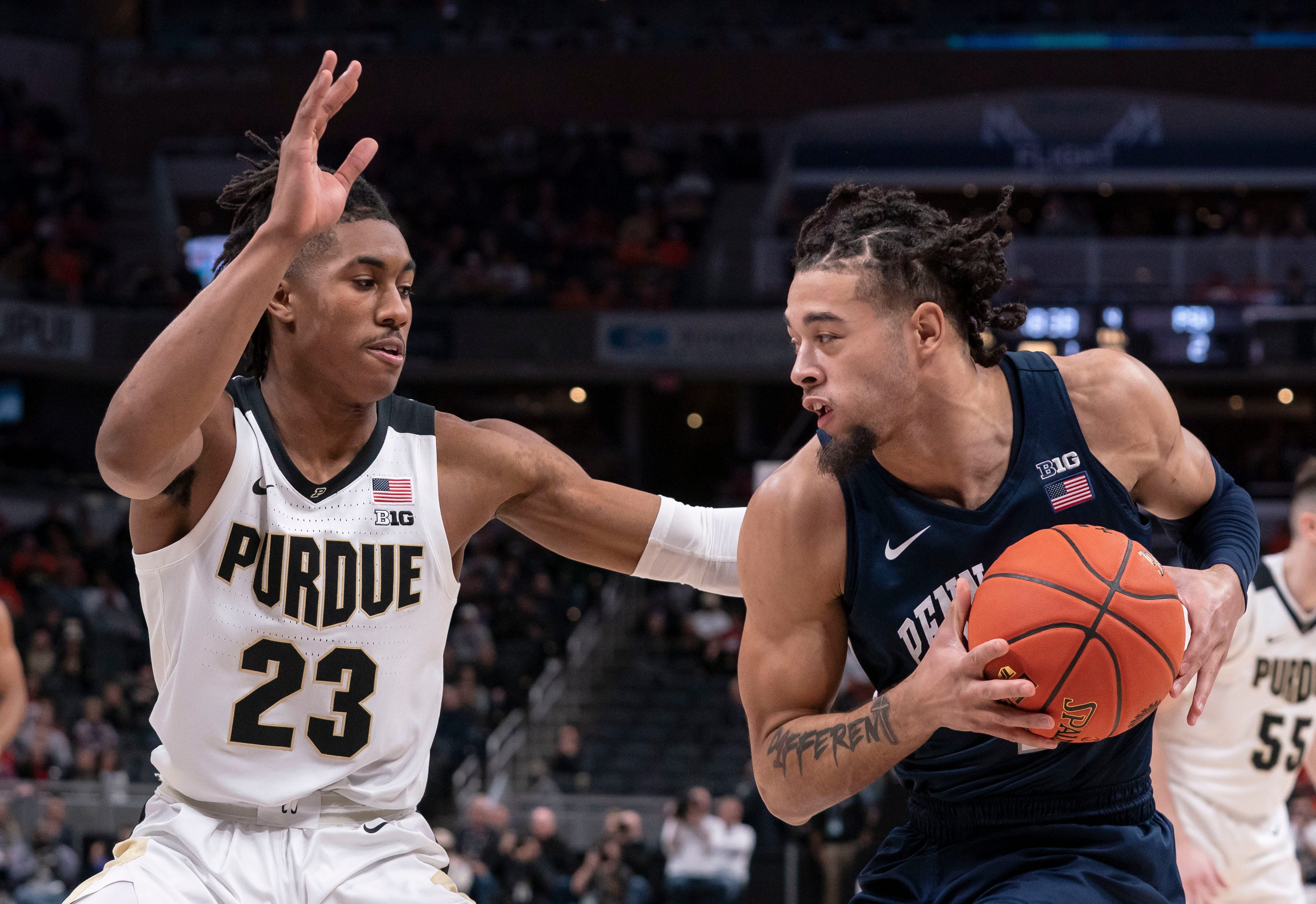 Purdue Boilermakers guard Jaden Ivey (23) guards Penn State Nittany Lions forward Seth Lundy (1) during the Big Ten tournament on Friday, March. 11, 2022, at Gainbridge Fieldhouse in Indianapolis. Purdue Boilermakers defeated the Penn State Nittany Lions, 69-61.&nbsp;
