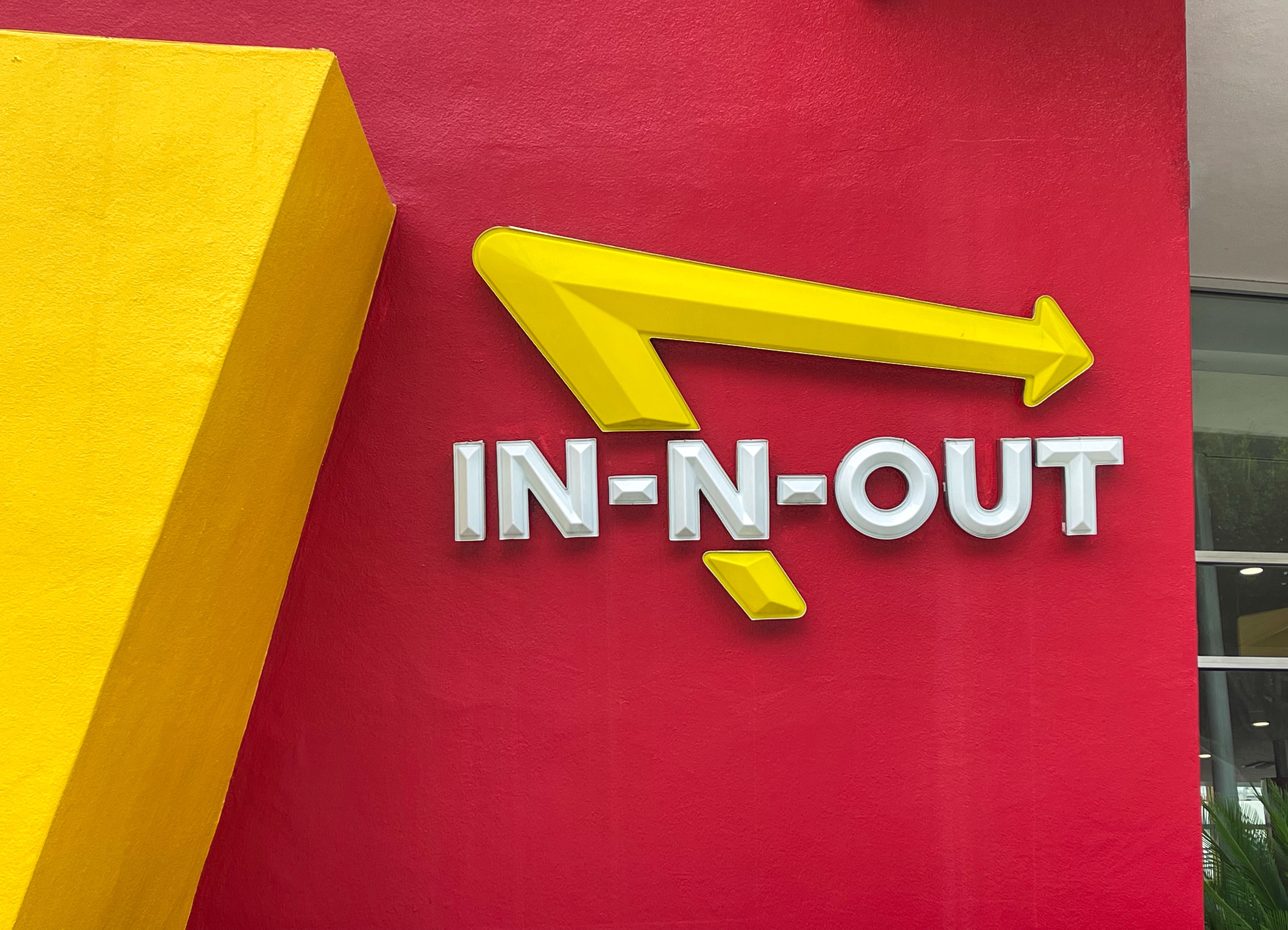 The exterior of an In-N-Out restaurant where just the logo is visible