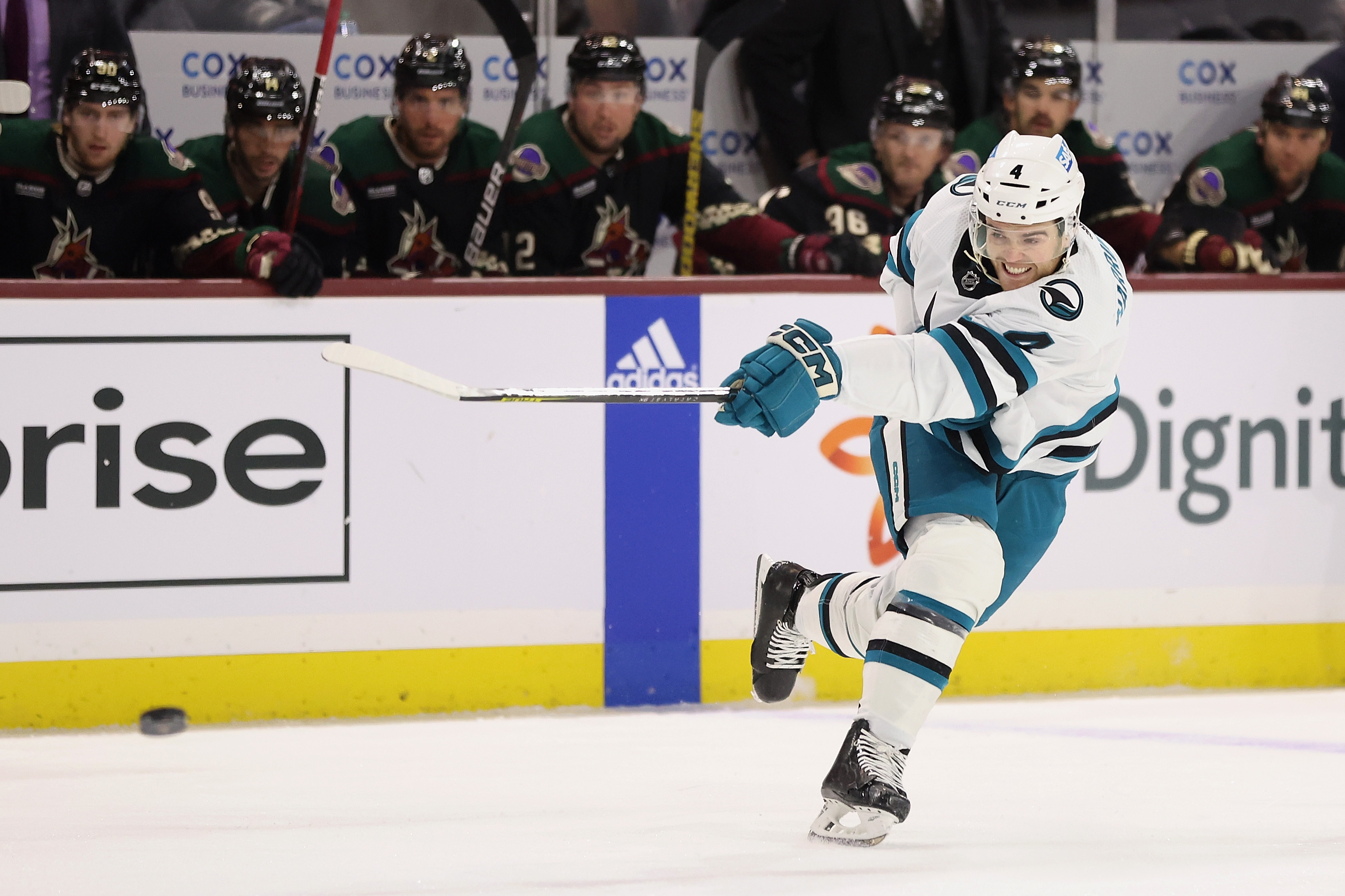 Scott Harrington #4 of the San Jose Sharks shoots the puck during the first period of the NHL game against the Arizona Coyotes at Mullett Arena on January 10, 2023 in Tempe, Arizona.