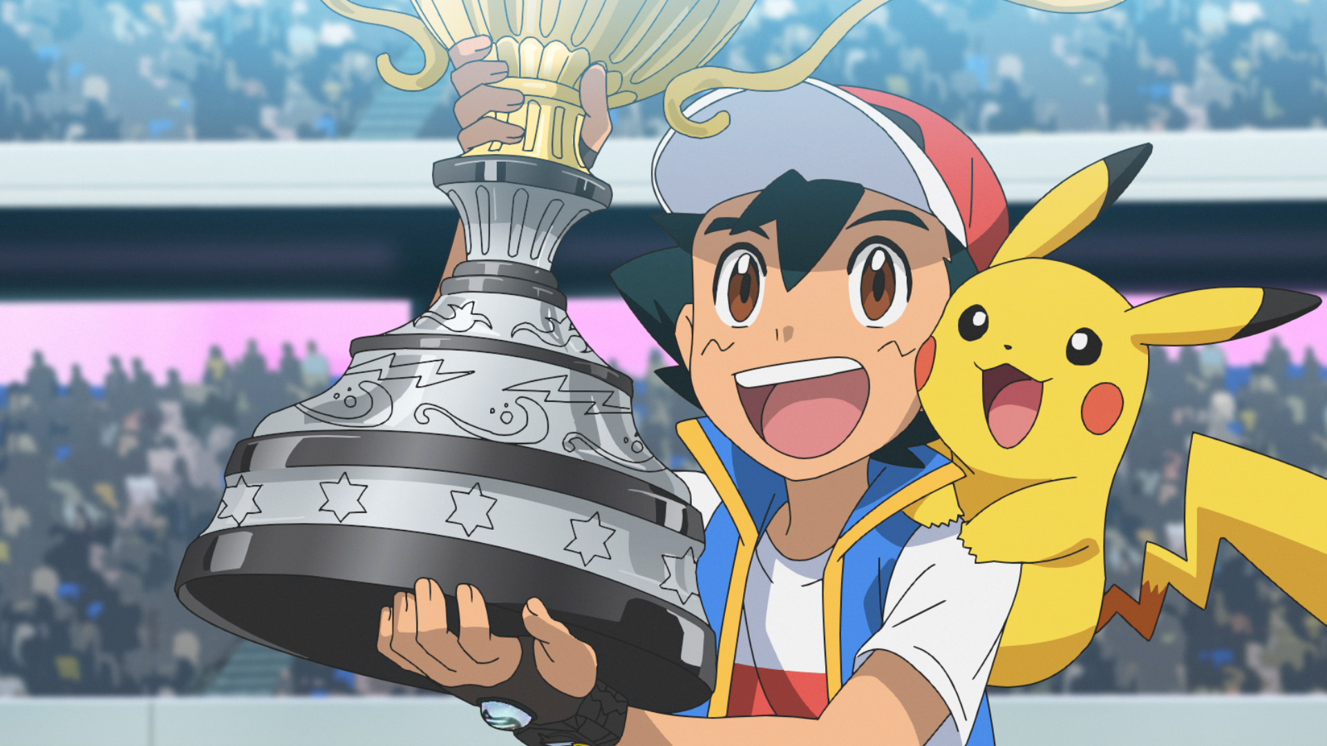 An image of Ash holding up a giant trophy in the Pokémon anime. Pikachu is sitting on his shoulder and they’re both smiling.