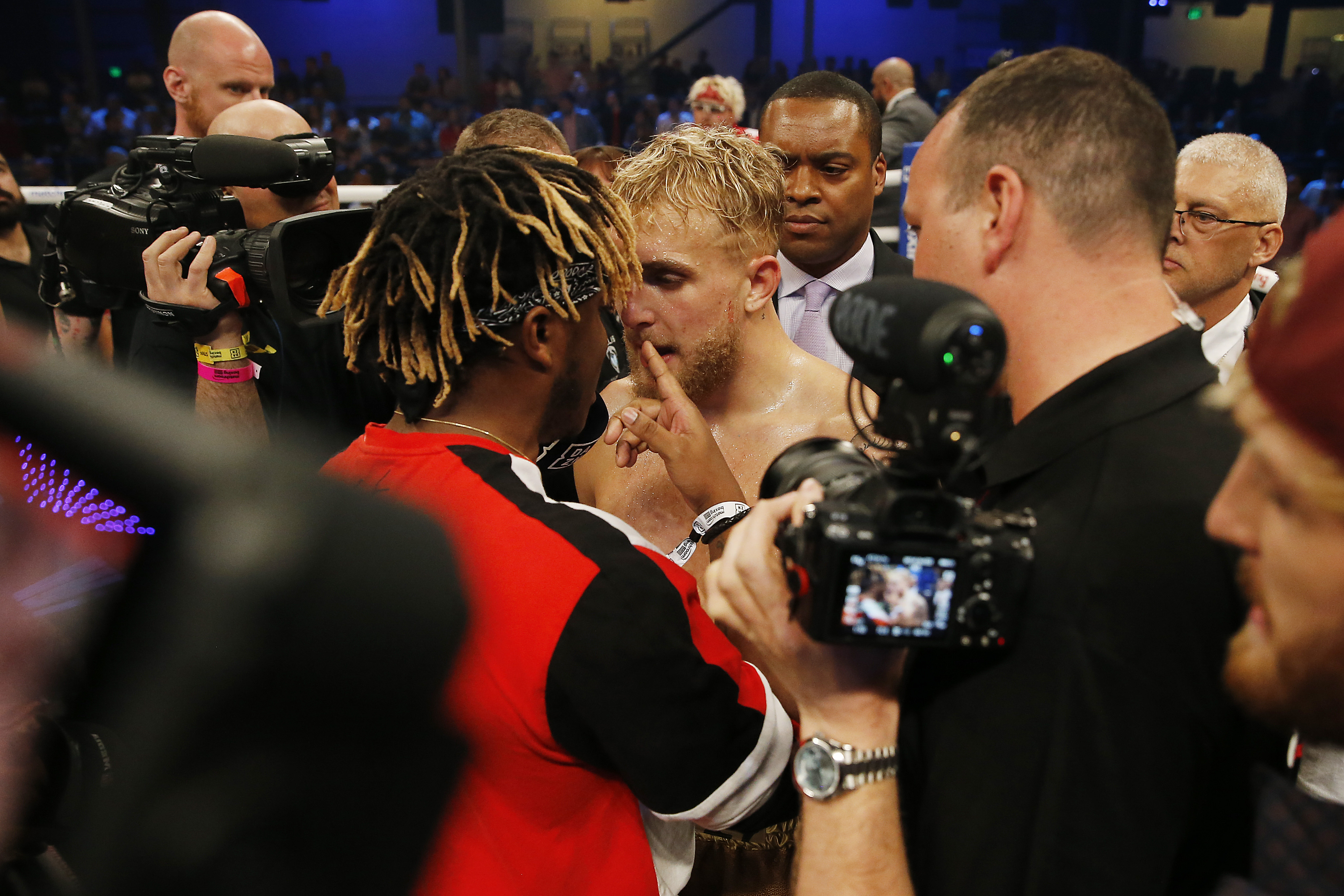 Jake Paul and KSI argue after Paul defeated AnEsonGib in a first round knockout during their fight at Meridian at Island Gardens on January 30, 2020 in Miami, Florida.