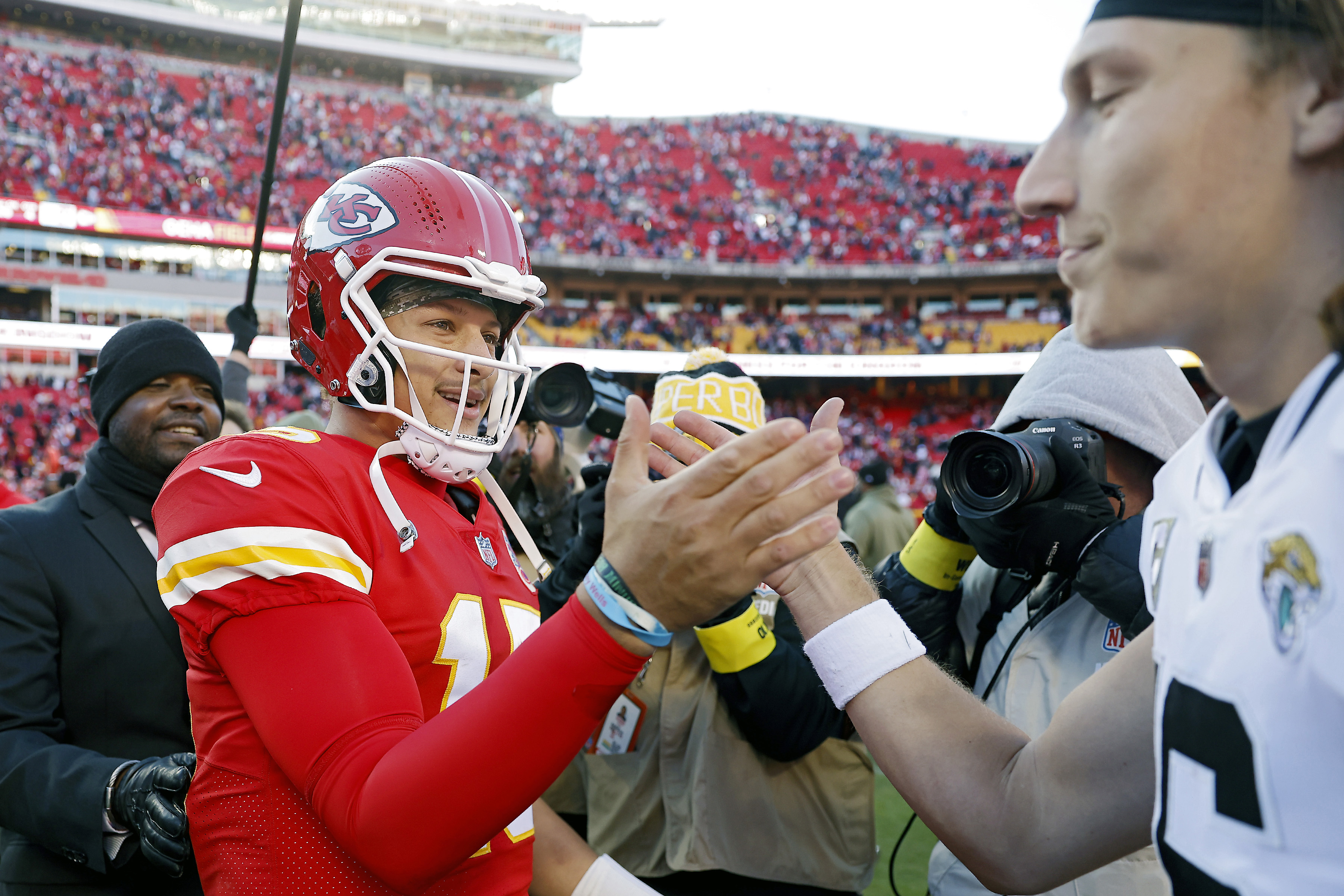 Patrick Mahomes #15 of the Kansas City Chiefs shakes hands with Trevor Lawrence #16 of the Jacksonville Jaguars after the Chiefs defeated the Jaguars 27-17 at Arrowhead Stadium on November 13, 2022 in Kansas City, Missouri.