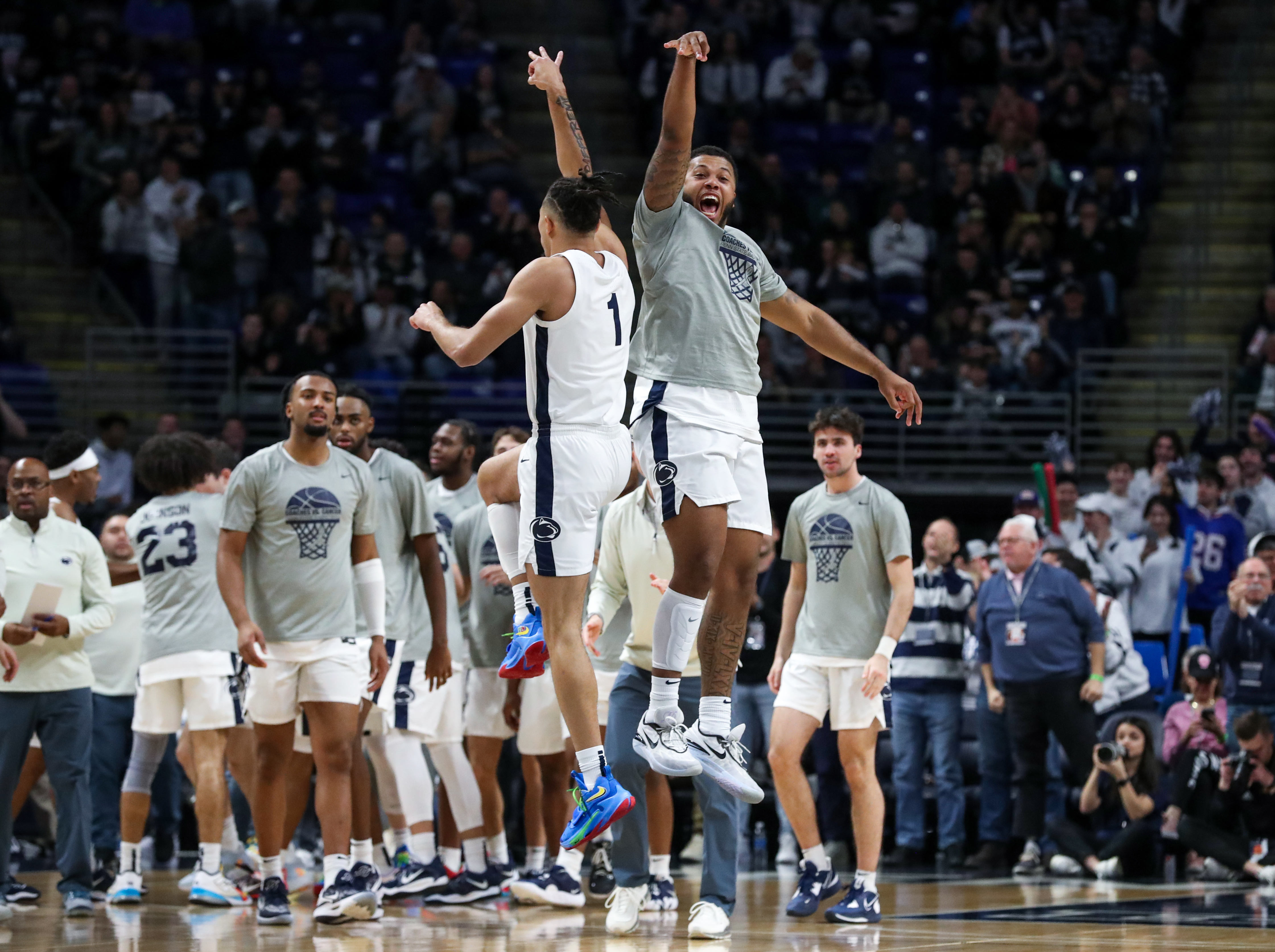 Jan 21, 2023; University Park, Pennsylvania, USA; Penn State Nittany Lions guard/forward Myles Dread (right) reacts after guard/forward Seth Lundy (1) made a three point shot prior to a timeout during the first half against the Nebraska Cornhuskers at Bryce Jordan Center.