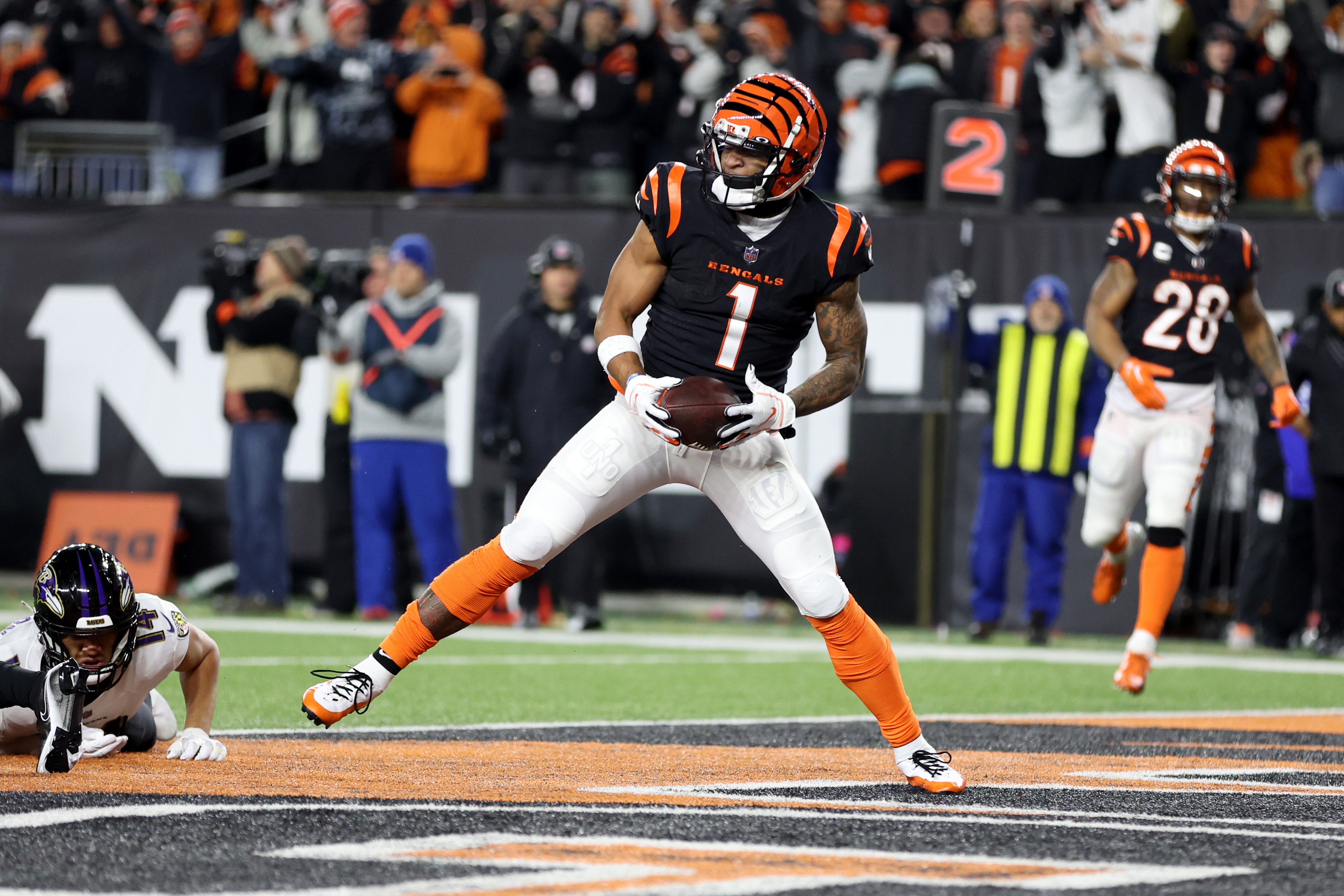 Ja’Marr Chase #1 of the Cincinnati Bengals celebrates after scoring a 7 yard touchdown against the Baltimore Ravens during the second quarter in the AFC Wild Card playoff game at Paycor Stadium on January 15, 2023 in Cincinnati, Ohio.