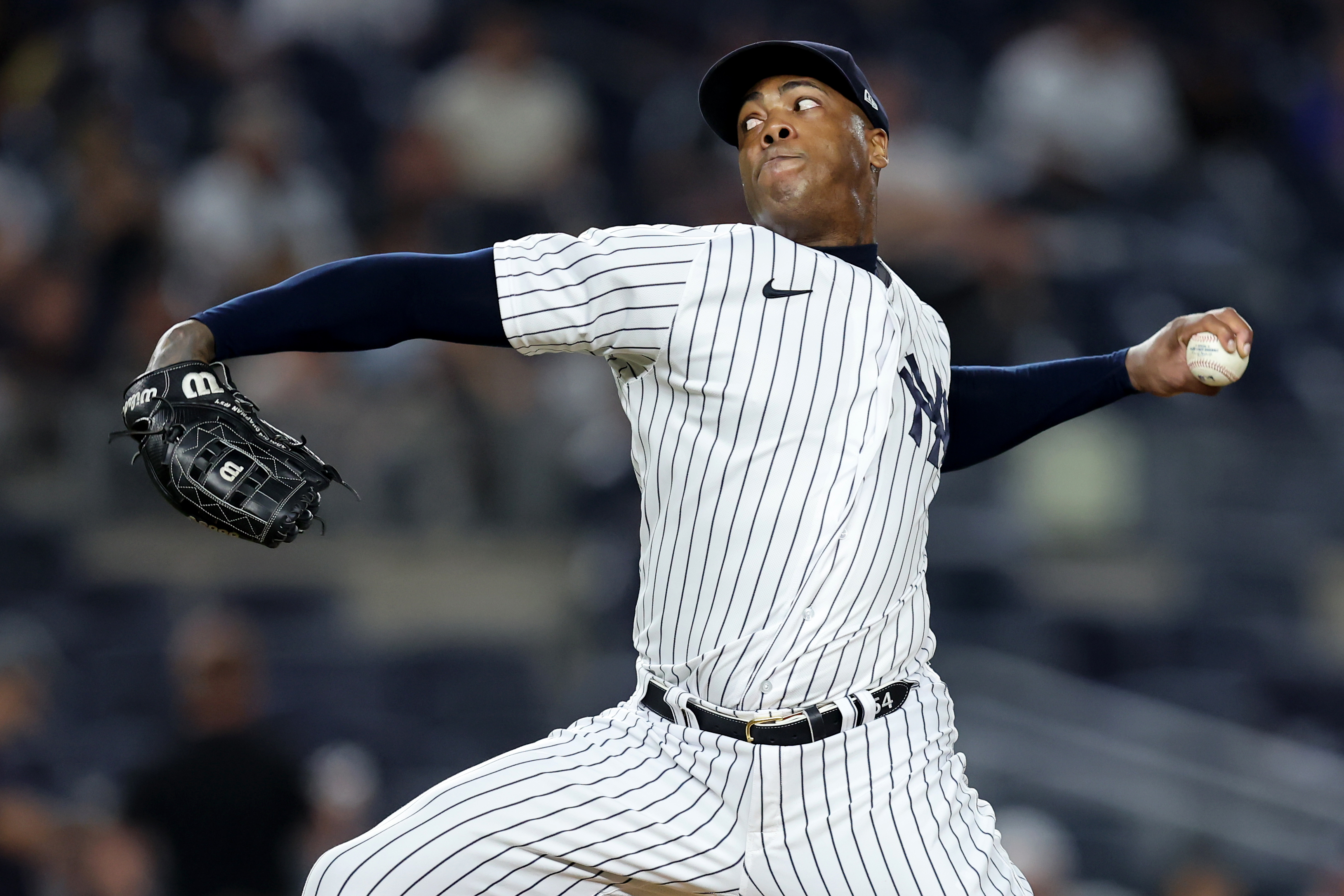 Bronx, New York, USA; New York Yankees relief pitcher Aroldis Chapman (54) pitches against the Tampa Bay Rays during the tenth inning at Yankee Stadium.