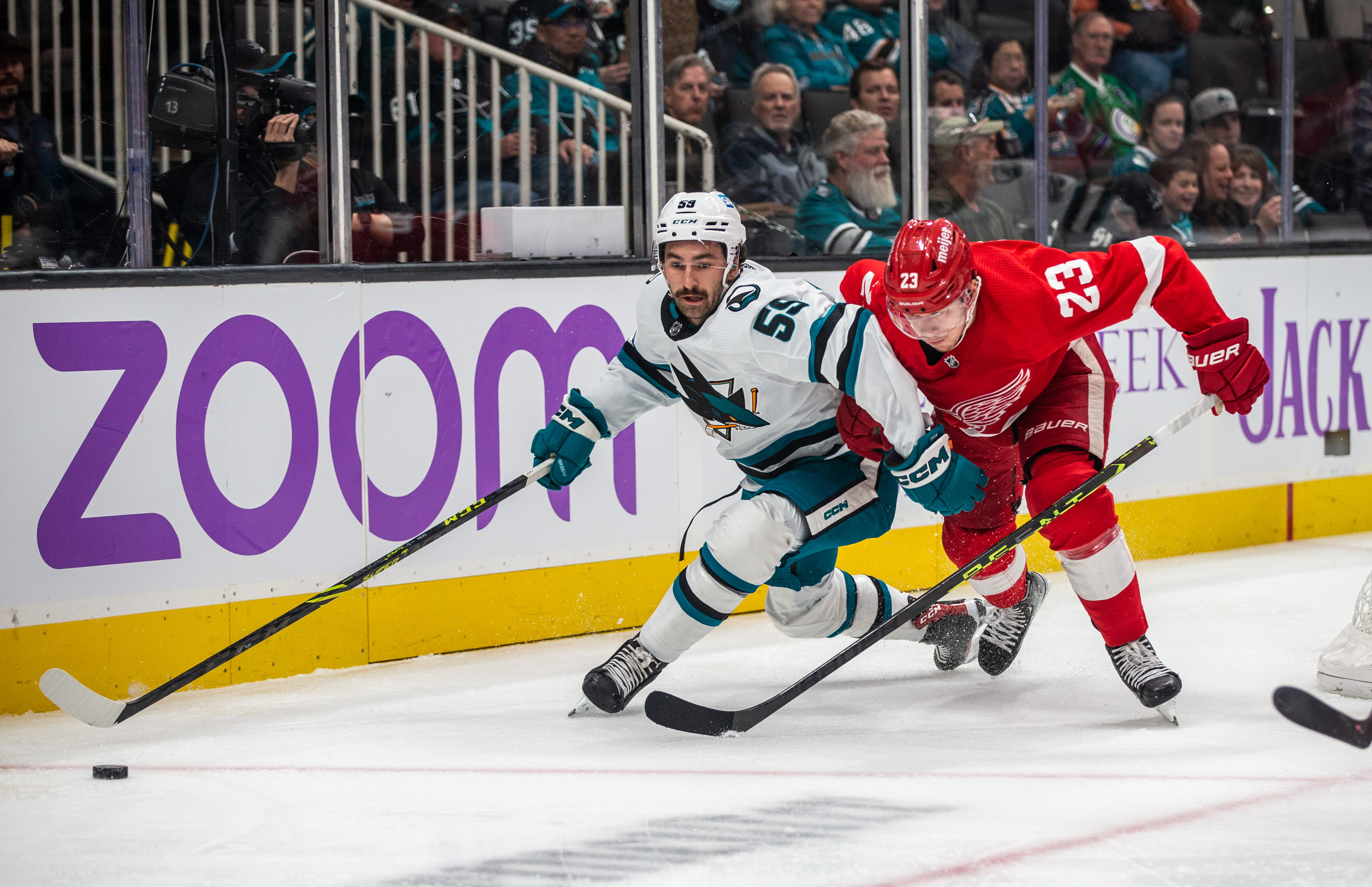 San Jose Sharks Defenceman Nick Cicek (59) keeps back Detroit Red Wings Right Wing Lucas Raymond (23) during the first period of a regular season NHL hockey game between the Detroit Red Wings and the San Jose Sharks on November 17, 2022, at SAP Center, in San Jose, CA.