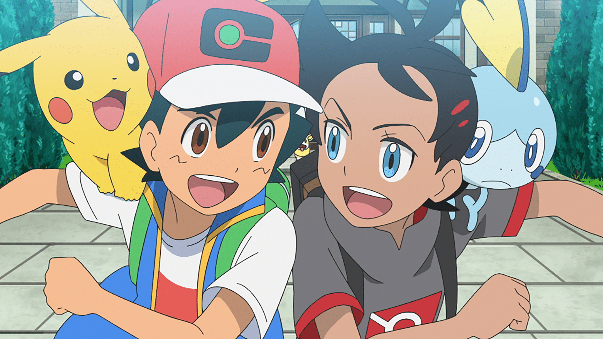 A smiling anime boy (Ash) with a yellow mouse creature on his shoulder (Pikachu) bumps shoulders with another smiling anime boy with (Goh), who has an apprehensive-looking fishlike creature on his shoulder. (Sobble).