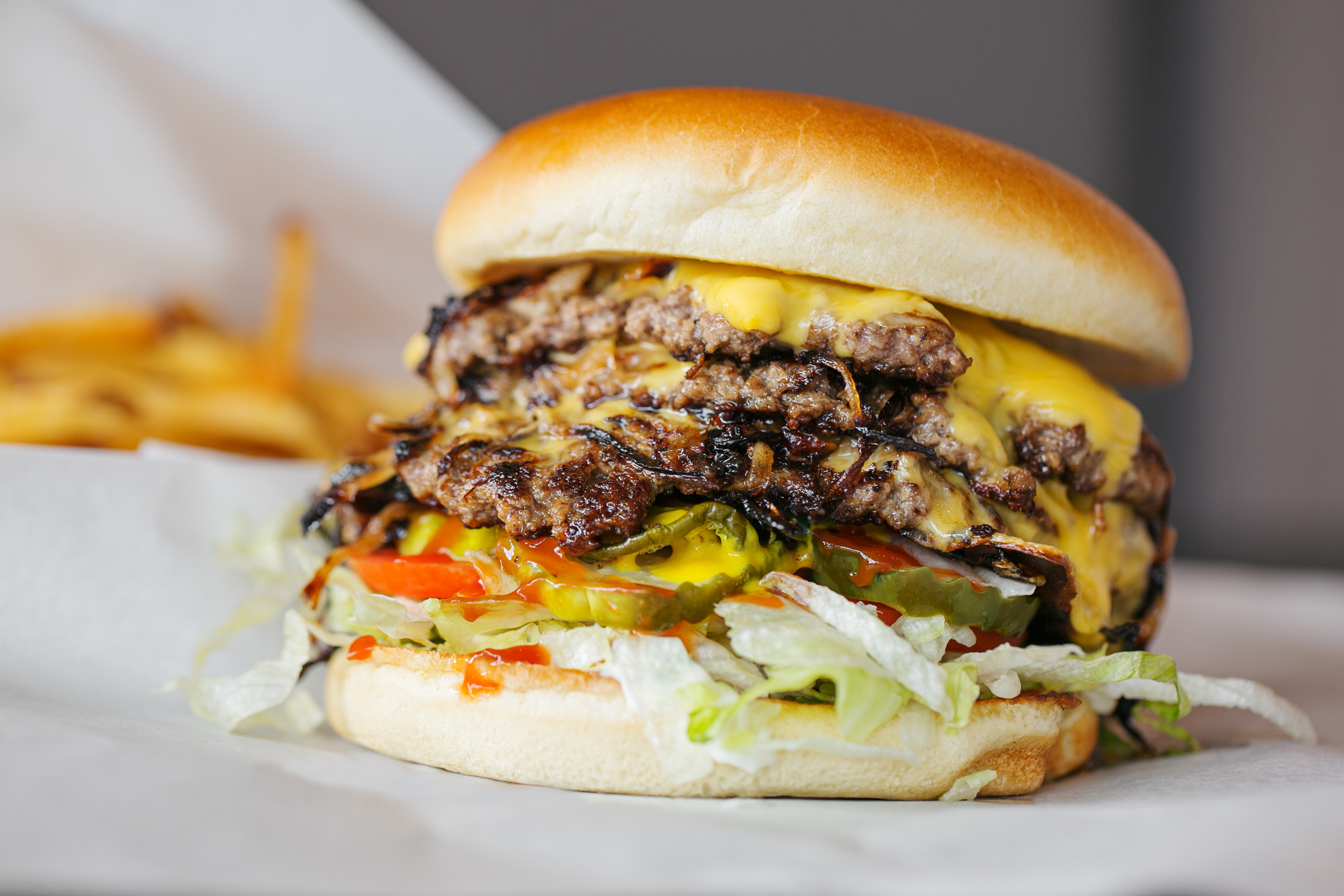A well-stacked double cheeseburger.