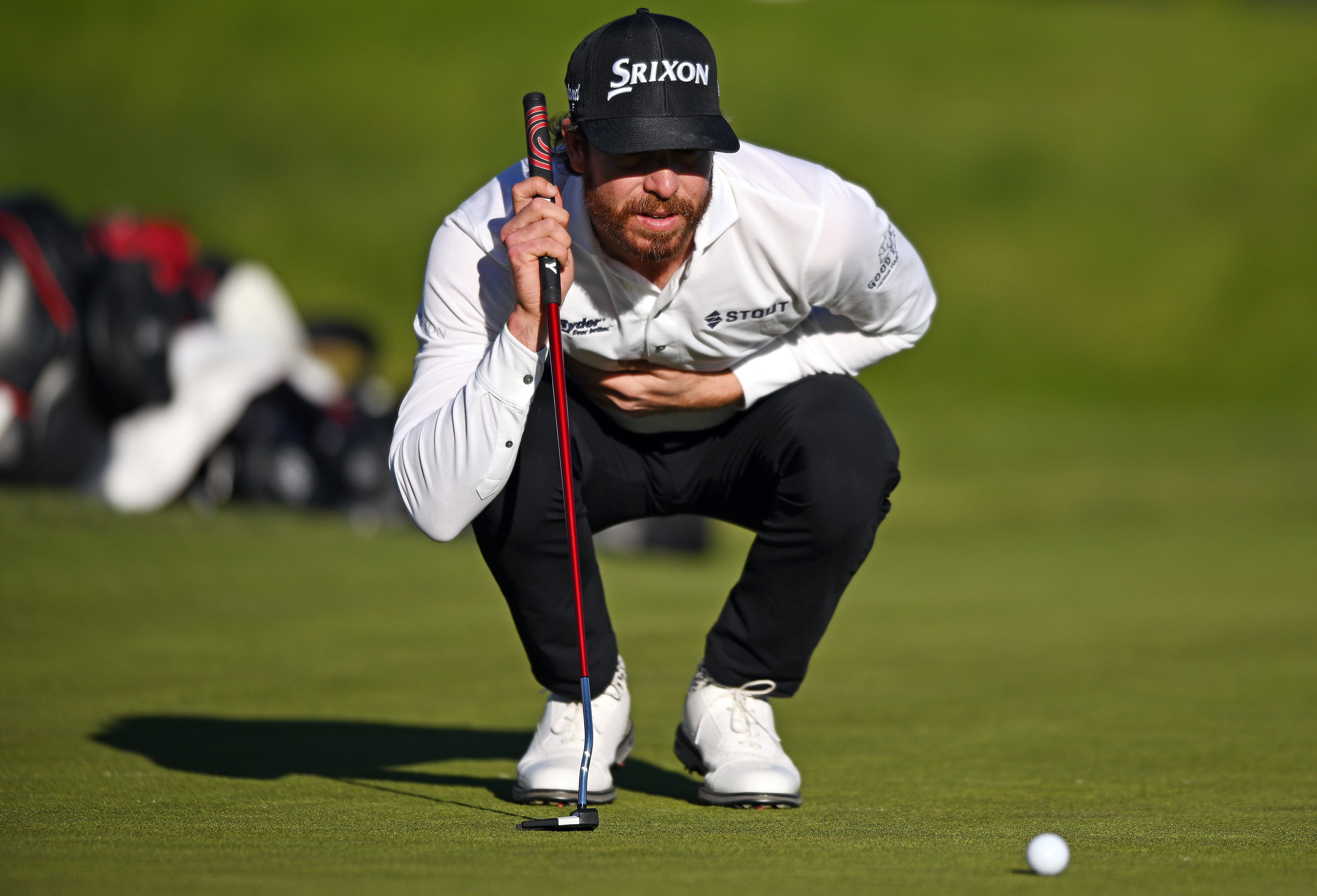 Sam Ryder of the United States lines up a putt on the 18th green of the South Course during the second round of the Farmers Insurance Open at Torrey Pines Golf Course on January 26, 2023 in La Jolla, California.