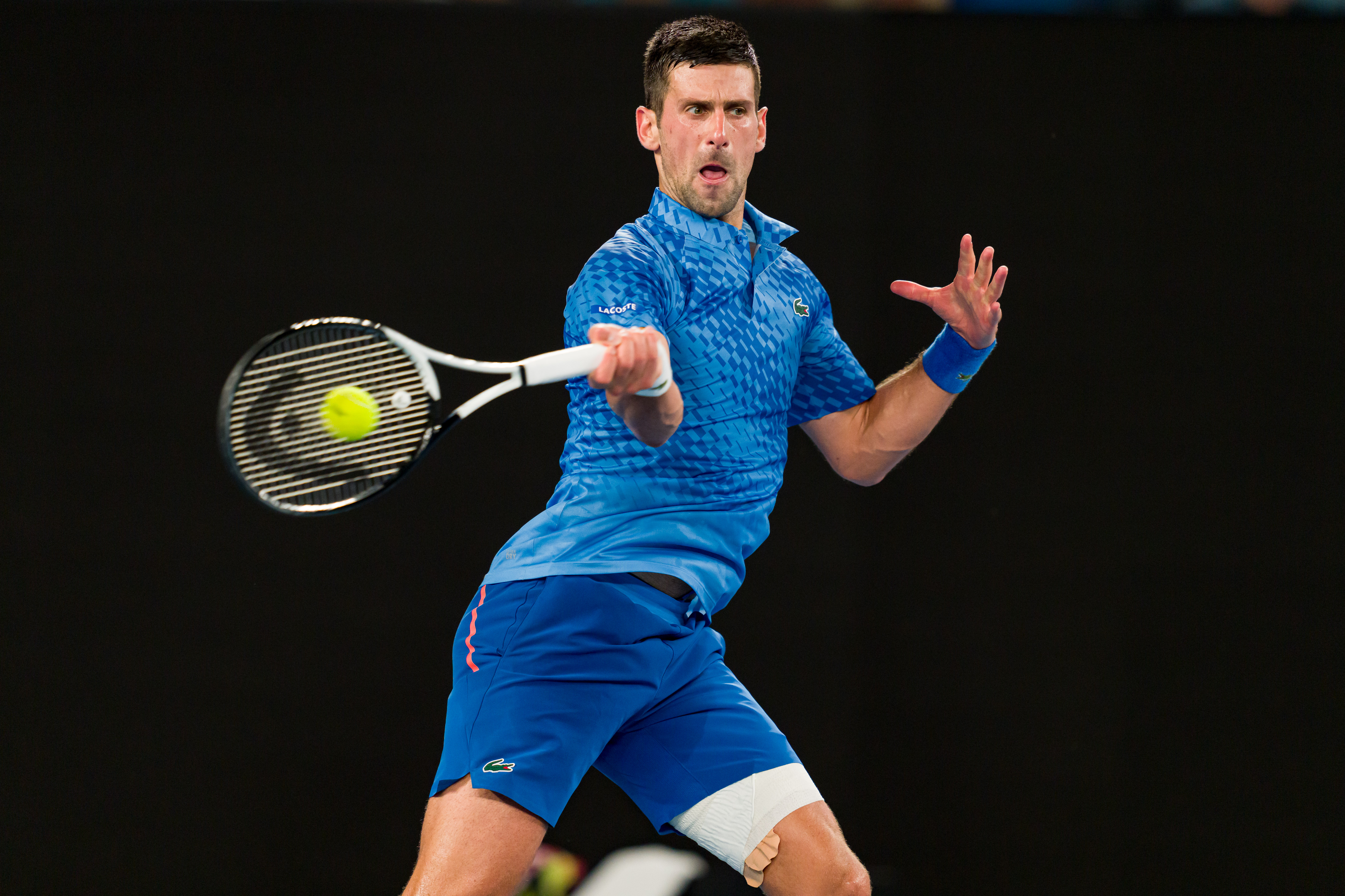 Novak Djokovic of Serbia plays forehand in the Semifinal singles match against Tommy Paul of the United States during day 12 of the 2023 Australian Open at Melbourne Park on January 27, 2023 in Melbourne, Australia.