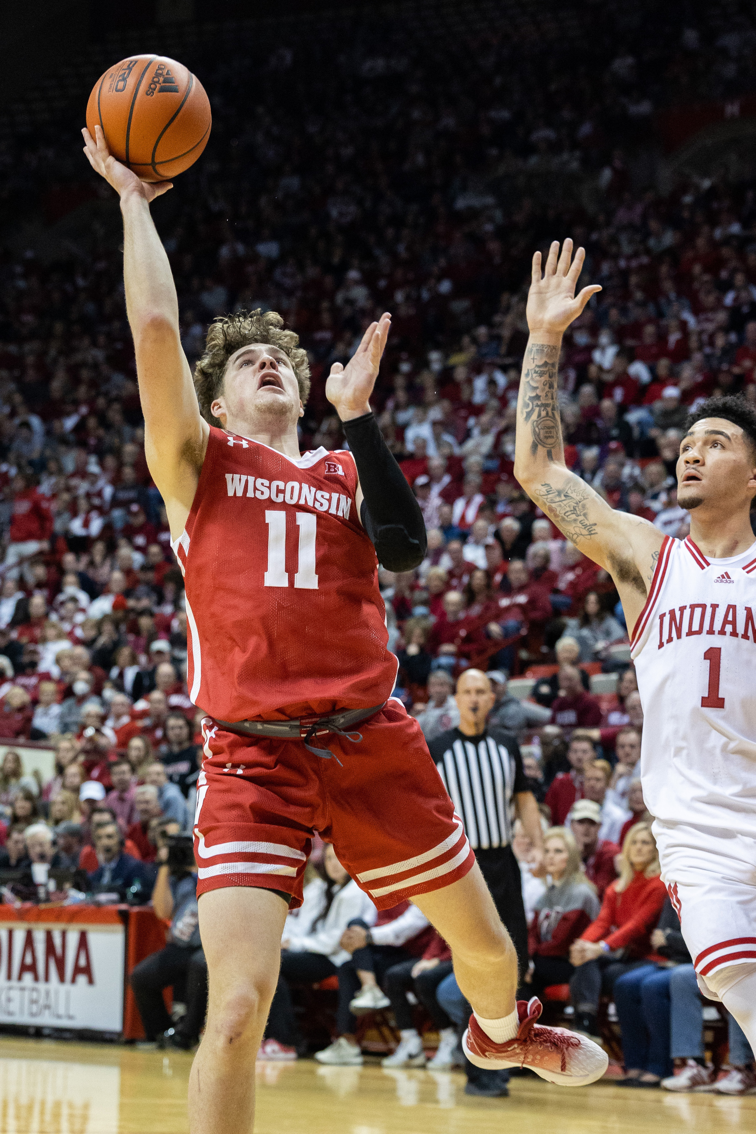 Wisconsin Badgers guard Max Klesmit shoots the ball against Indiana Hoosiers guard Jalen Hood-Schifino in the second half at Simon Skjodt Assembly Hall.