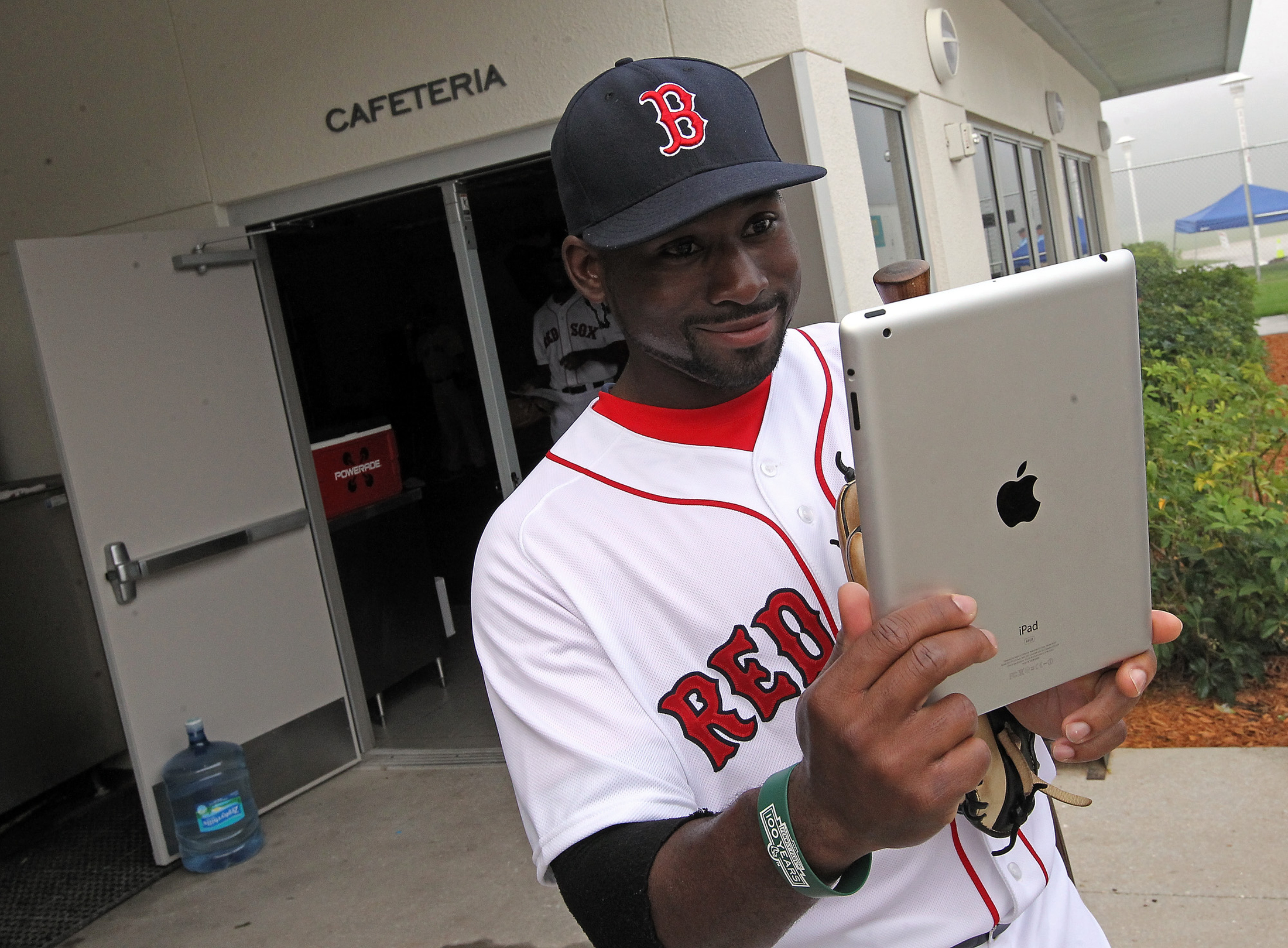 (Fort Myers, FL, 02/23/14) Using an iPad, Boston Red Sox center fielder Jackie Bradley Jr. photographs himself and then Tweets it during Picture Day at Red Sox Spring Training on Sunday, February 23, 2014. Staff Photo by Matt Stone