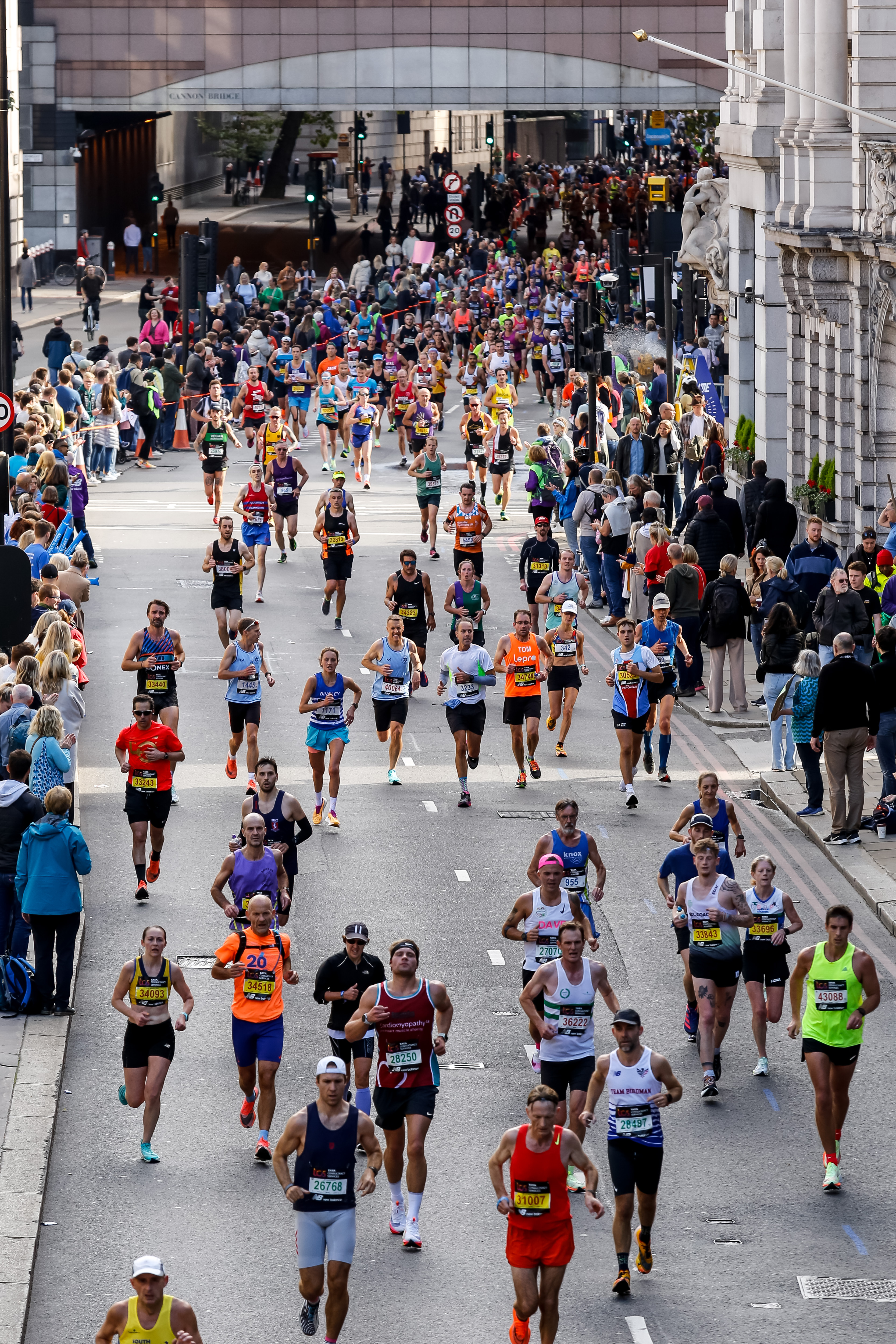 Participants of TCS 2022 London Marathon run through central...