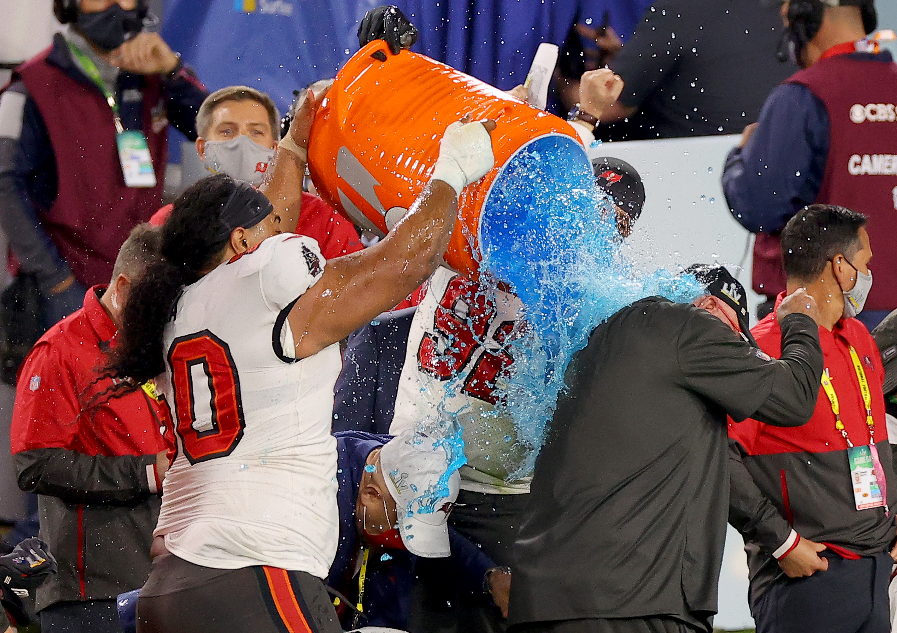 Vita Vea #50 and William Gholston #92 of the Tampa Bay Buccaneers give head coach Bruce Arians a Gatorade shower after winning Super Bowl LV at Raymond James Stadium on February 07, 2021 in Tampa, Florida. The Buccaneers defeated the Chieft 31-9.