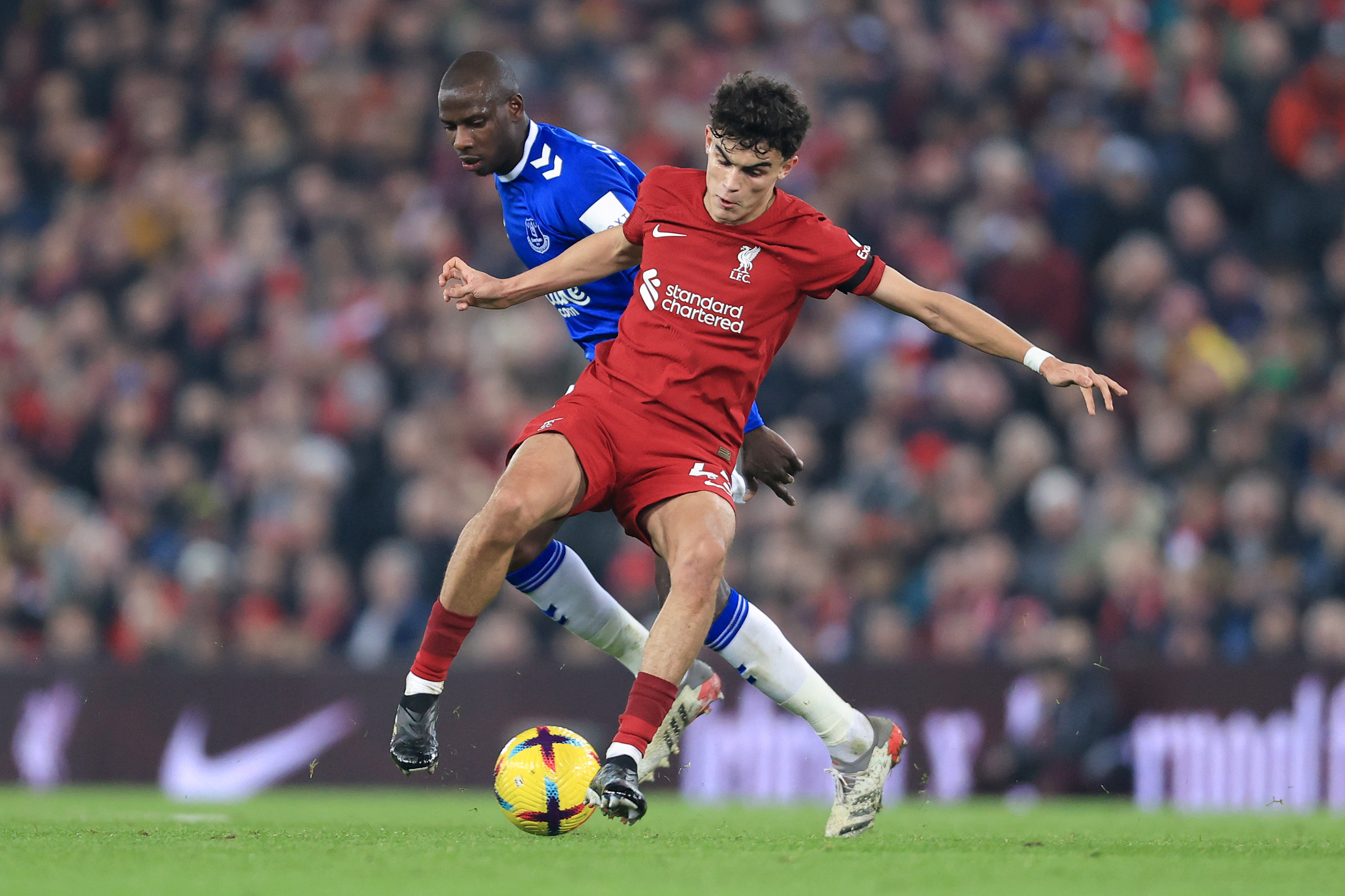 Stefan Bajcetic of Liverpool and Abdoulaye Doucoure of Everton during the Premier League match between Liverpool FC and Everton FC at Anfield on February 13, 2023 in Liverpool, United Kingdom.